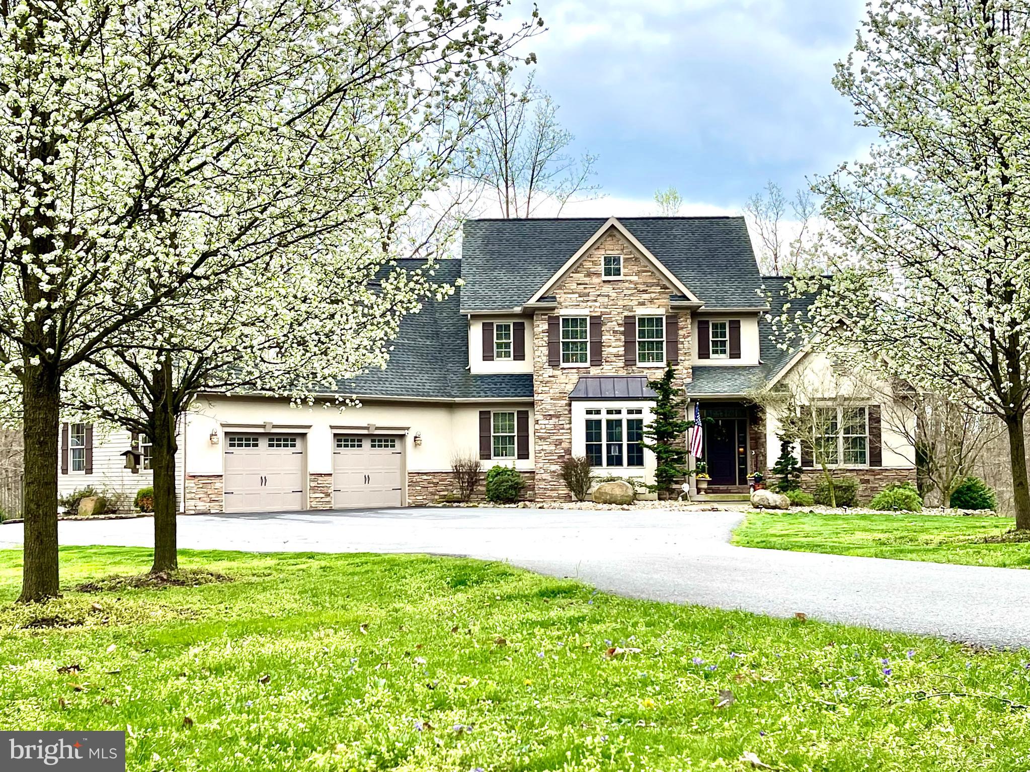 Spectacular, Custom Home with 9.48 acres. Welcome to your dream home! As you enter, you will be greeted by wood floors and an abundance of natural light that leads into the living room. The eat-in kitchen will be the heart of the home. Upgraded countertops, ample counter space- great for food preparation, a walk-in pantry and stainless steel appliances will be ideal for meal preparation. The open plan flows into the family room where the two story height and stone surrounded fireplace give it a grand feel. Working remotely? The home office will be the place for you. The first level primary bedroom saves you from climbing the stairs. It has an updated en suite with a walk-in shower and a soaking tub plus a spacious walk-in closet sure to please shoppers. A laundry room with a craft area,  a mud room with built in cubbies- great space for  backpacks and shoes and a full bath round out the first level. The second level has two good size bedrooms that share a Jack and Jill Bathroom, a third spacious guest room suite with its own full bath and a large bonus room that could be used as a second home office, a playroom or a room for hobbies. The lower level has a recreation room where you can watch the big game or where kids can hang out with friends. A second room could be used as a home gym complete with a half bath. The lower level unfinished area has space for seasonal items and holiday decor to be stored. Enjoy outdoor living? The screened in porch overlooks the in-ground heated salt water pool with automatic cover. Grill on the spacious deck and host a barbecue. Two fire pits mean endless s'mores! Animal lovers will appreciate the two stall barn with automatic waterers and three fenced pastures. There is a one room 'cabin' on the property with electric, running water and a wood burning stove. It's a cool space for teens to hang out or an ideal spot to have a birthday party. There are hiking trails, horse trails,  spring fed ponds and creeks adjacent to the property. The privacy and peace this property has to offer are a rare find.  Located at the end of a quiet cul de sac, this property is a Must See!