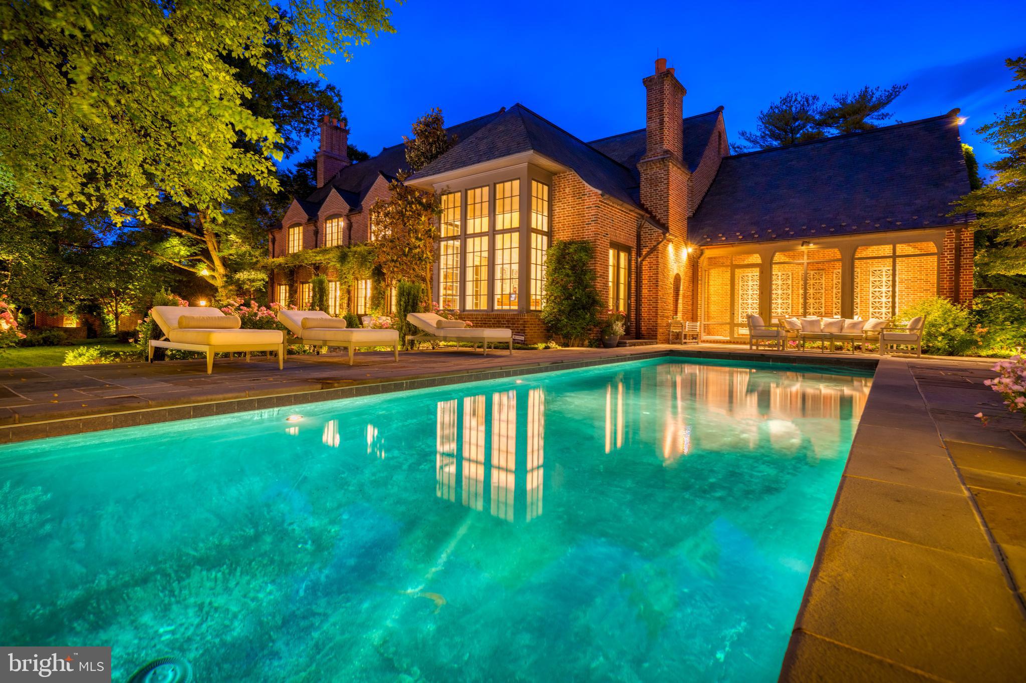 Never leave home again! Do not miss this one-of-a kind Kenwood Oasis! This 7 BR, 7 FBA, 3 HBA stunning home, custom built by Jim Gibson, offers gracious formal entertaining spaces that seamlessly flow with comfortable family living. Situated on a flat lot, the expansive garden extends the thoughtfully planned living spaces to the outdoors including screened porch, heated pool, blue stone pool house, built-in pizza oven, flagstone entertaining terraces, open lawn, reading nook, fountain and established landscaping. Inside, no detail was overlooked - towering 10'7" ceilings, wide plank floors, custom french doors, and paneling throughout. The main level wows with a 30  foyer, Washington style entertaining sized Living Room and Dining Room, Study with reclaimed Irish pine paneling, and light filled eat-in Kitchen featuring La Cornue range which opens to Family Room with vaulted ceilings and fireplace. Upstairs the Master Suite includes custom iron juliet balcony, fireplace, marble bath with steam shower and a room-sized walk-in closet, 4 additional bedroom suites, sunny laundry room, and back staircase. The third level doubles as a private bedroom suite or artist studio with full bath, abundant storage and wet bar. Or escape to the lower level featuring a recreation room with fireplace, copper countered bar, 1700 bottle wine cellar, playroom, home gym, sauna, cedar closet and lots of storage. A 2-car garage with pet spa complete this incredible offering.