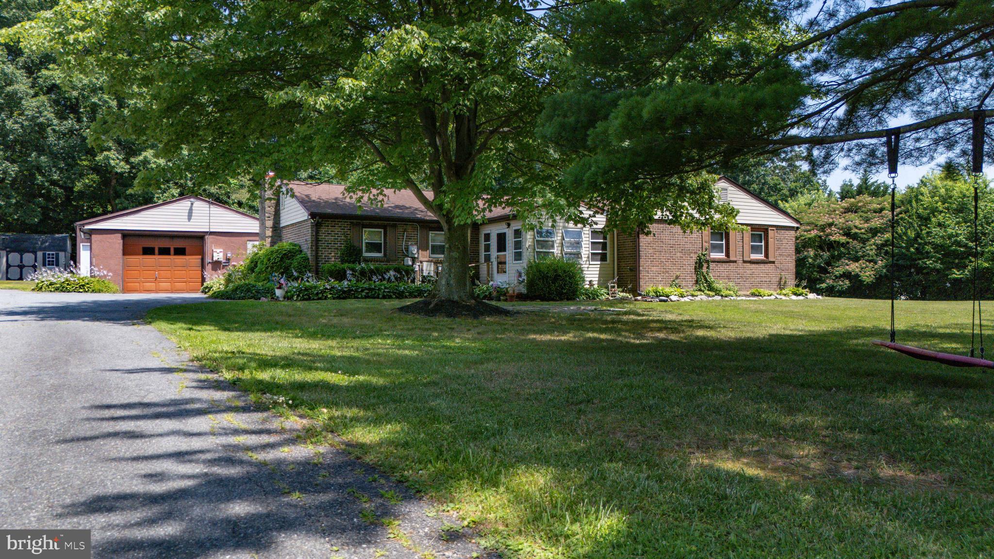 Welcome home to this spacious 3 bedroom, 2.5 bath rancher nestled on 1.5 acres. Set well back from the road and backing to mature trees, this property offers the perfect blend of privacy and peaceful surroundings. As you make your way inside, there is a front porch and spacious foyer. The kitchen features ample cabinet space and an open layout that flows seamlessly into the dining area and living room. Just off the living room is a cozy office - perfect for working from home. A second family room around the corner from the kitchen offers built-in shelving and a fireplace. Spend summer days on the rear deck overlooking the impressive 20'x40' saltwater pool with solar heater (saltinator new 2025). Car enthusiasts, hobbyists, and those needing extra storage will appreciate the two detached garages measuring approximately 25'x25' and 25'x28', plus an additional storage shed. Conveniently located near Rt 40, I-95, North East restaurants and marinas, tax free shopping in Newark, DE, and short drive to Harford County. Schedule your private tour today!