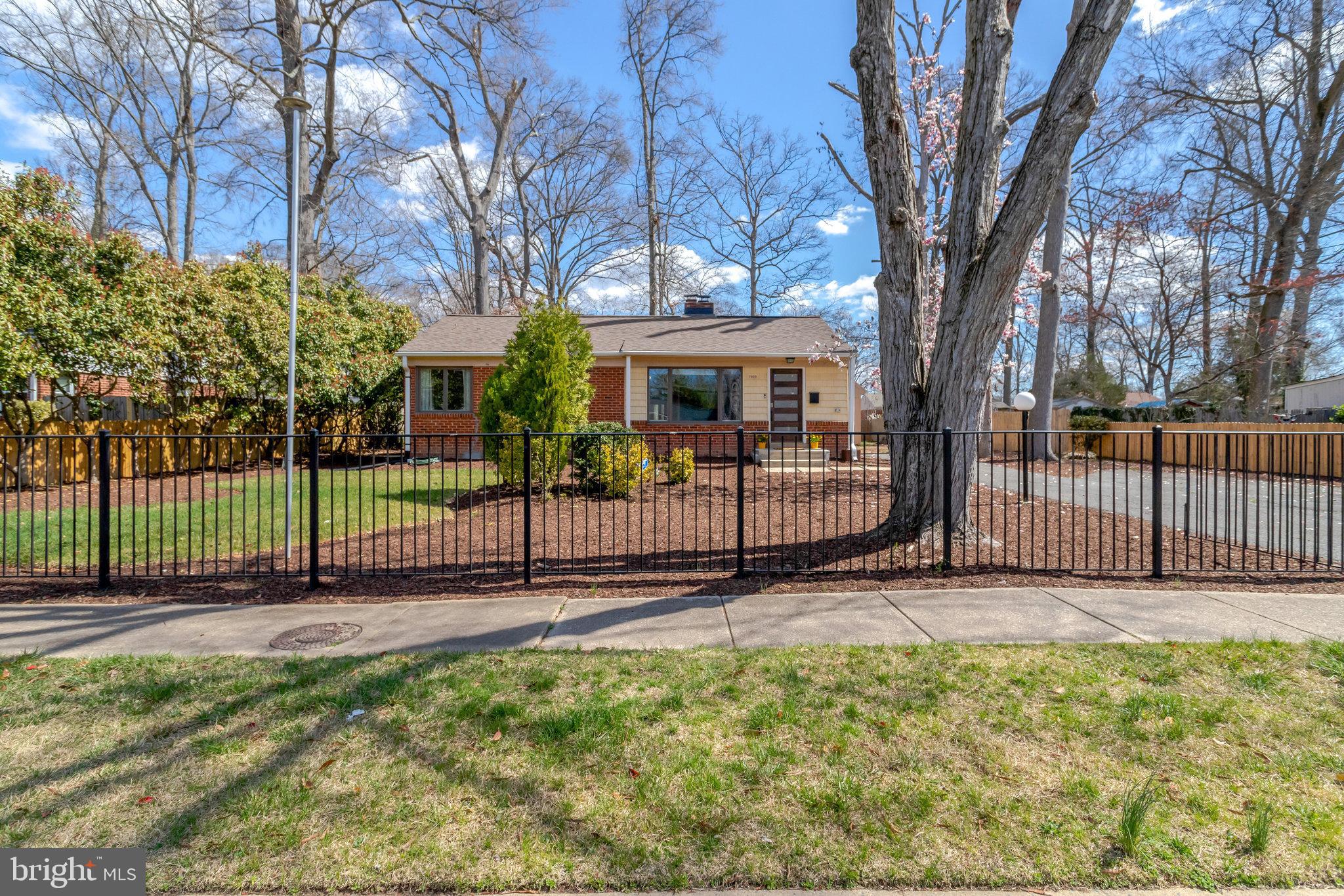Welcome to your next home—A beautifully updated and meticulously maintained mid-century, transitional gated ranch, boasting a large split-level addition in the picturesque Mount Vernon Woods area. This lovely 3 bedroom, 2 bathroom residence offers the perfect blend of modern luxury and timeless elegance.  Home includes a luxurious Master Suite with skylight, dressing room, walk-in closet, and a spa-like master bath for ultimate relaxation. The family room is a masterpiece of design with high ceilings, skylight, and a stunning wall of windows that bathe the interior in natural light. The bright and airy gourmet kitchen is a chef's delight. Recently remodeled with quartz countertops, a pot filler, and a natural gas 5-burner stove, complemented by stainless steel appliances and ample cabinetry. It's equipped with everything needed for culinary adventures and new delectable creations. The fully-fenced backyard offers endless entertainment possibilities—featuring a large deck and additional patio space, perfect for gatherings and relaxation. The detached, oversized garage provides adequate space for one vehicle and additional storage solutions. Located in a prime Northern Virginia location: Enjoy the convenience of being close to Old Town Alexandria, The Pentagon, Lorton, Fort Belvoir, and Springfield. Only 2 miles from Mount Vernon Country Club! Situated on a 1/3-acre homesite ideal for cookouts and gardening enthusiasts. In addition, home is located in close proximity to key commuting routes making travel to Arlington, DC, Old Town, and Kingstowne a breeze. This charming home is freshly painted and features elegant hardwood floors throughout. It is an ideal choice for enjoying Northern Virginia living at its finest. Come tour this spacious Mid-Century Modern Ranch in Mount Vernon Woods before it is no longer available.