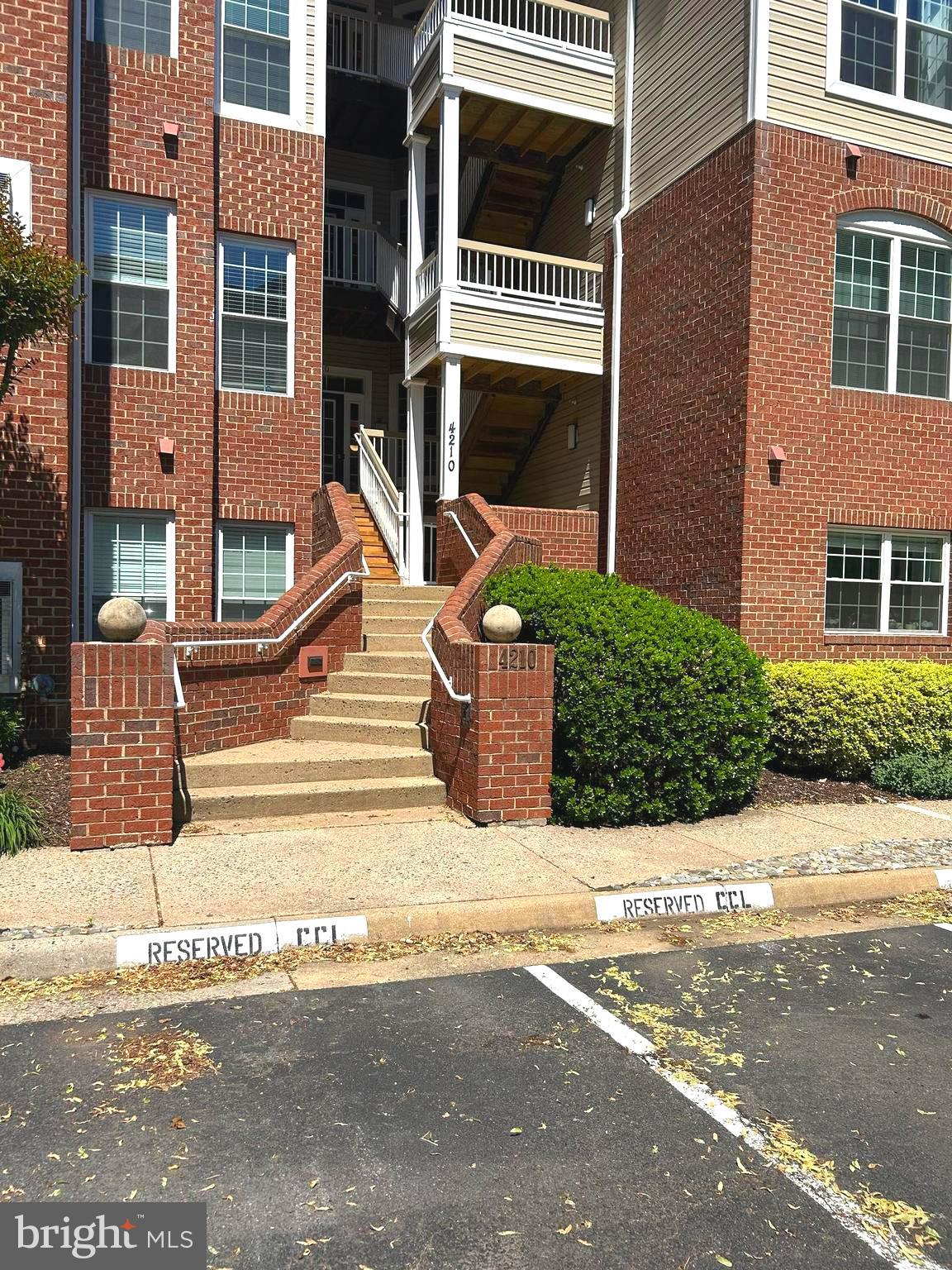 PLEASE NOTE---This lovely condo --HAS TWO  entrances.--  One entrance--NO STEPS-- on side of building brings you right into the lobby of your condo.  The front  entrance is 10 steps up (one flight) then 5 steps down to your lobby entrance to your condo.

Welcome to 4210 Mozart Brigade Ln - #F  This lovely corner unit has 1500  sq ft,  open and spaceious floor plan.  This unit  is ready for moving in and enjoy the tranquility  of your deck overlooking  the pond, surrounded by lush greenery.  This home has been updated with new carpet, painted through out, quartz counter tops, new cabinets with new appliances..  The en-suite  is located to one side and the other two bedrooms  and bath are located on the right side of the condo as you walk into your   Spacious storage through out.  Community amenites iclude pool, clubhouse, fitness center, tennis courts, playground  scenic walking paths.   Fair Oaks Mall is about 10 minites away .    Convient location to Dulles Airport,  Silver Line Metro and all major commuter routes.