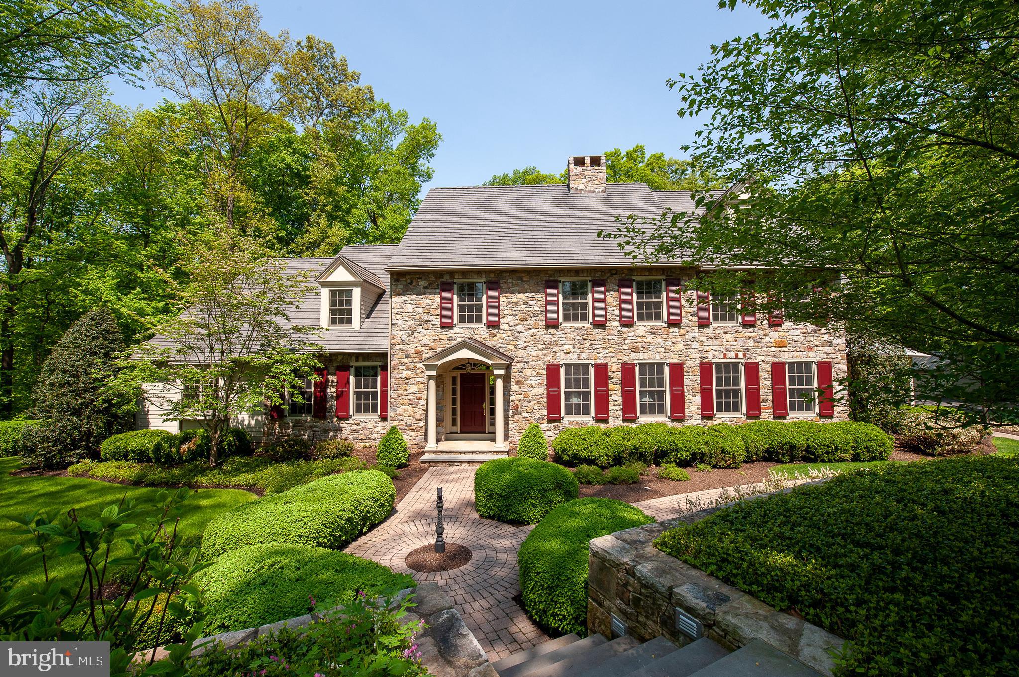 A stunning Bucks County home with old world charms and the convenience of modern amenities.  This private wooded estate is quietly nestled away on ten acres of ground.  A first floor master bedroom with matching closets, spacious bath, and a private sitting room complete with fireplace.  Modern kitchen with a grand stone fireplace, private eating area, with adjacent butler's pantry and stunning formal dining room.  A grand formal entryway which flows seamlessly into a stone face central living room with an offset wood detailed private office and drawing room.  The main spiral staircase connects all floors of this lovely home.  Spacious hallways with beautiful wood floors and lush carpets serving many bedrooms, sewing room, second floor laundry, and baths.  End hall traditional staircase provides easy access from all floors.  The workmanship and attention to detail cannot be overstated.  The lower level features a professional quality audio room with in home theater and projector.  It was painstakingly designed to provide both peak acoustic quality and individual comfort.  Walk out access from both the first floor and lower level to the rear manicured patio and flower beds.  All utilities in the home are magnificently maintained and are of the best possible quality.  The home offers spotless climate controlled garage space for six vehicles.  Private gate access to the property with a carefully hidden fence line.  Built with the utmost care by acclaimed area home builder Richard Zaveta.  Please enjoy our cutting edge video presentation and three dimensional rendering of the property.  All features and measurements are available for view with our embedded digital renderings.  Inquire today and experience the possibilities of this unique home.