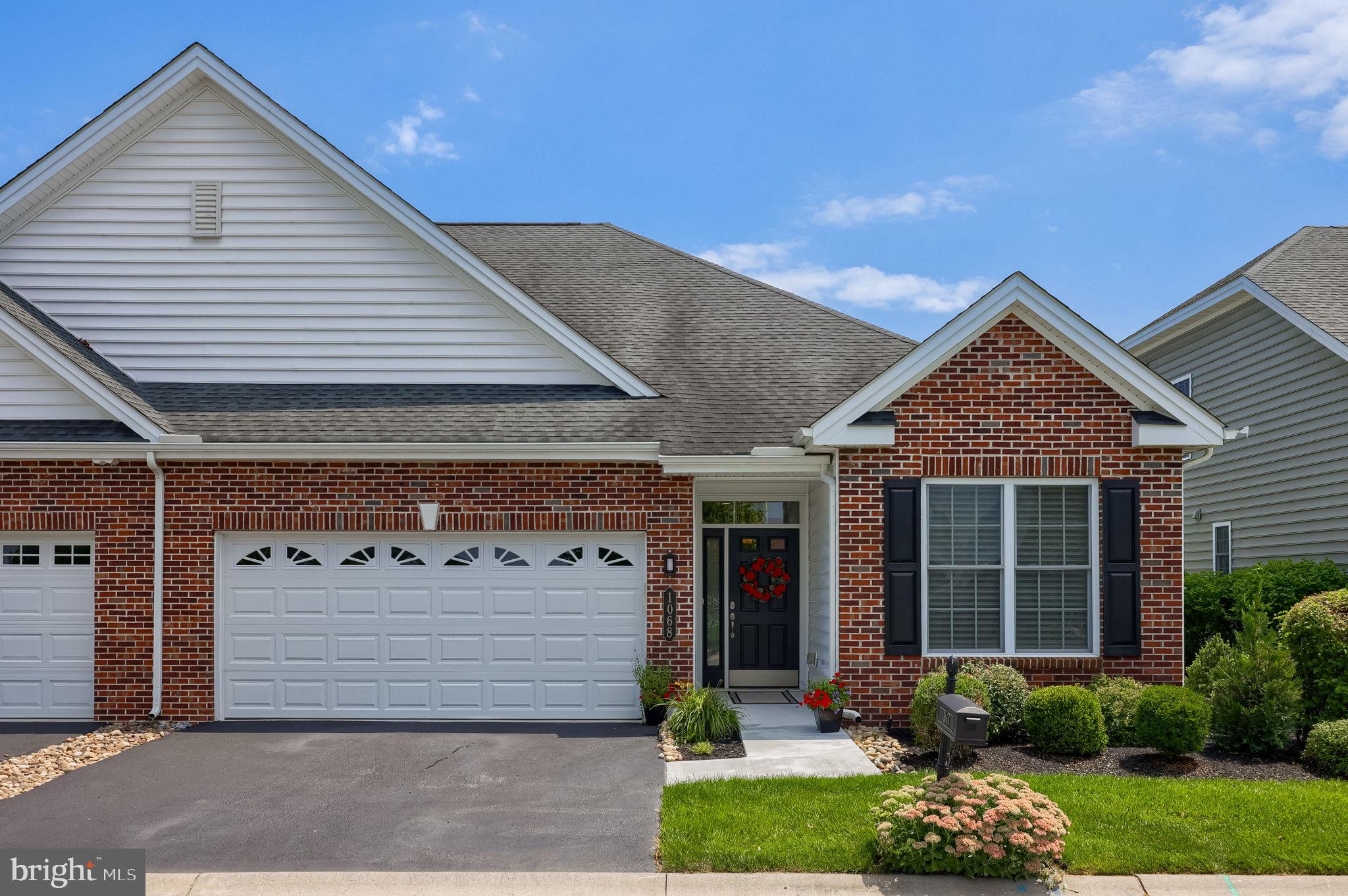 Welcome to 1068 Constitution Drive in the highly desirable Traditions of America at Lititz, a premier 55+ community in Lancaster County. This professionally updated, ADA-compliant home combines elegant design with exceptional accessibility. Upon entering notice the roomy foyer with a beautiful tray ceiling and lighting.  The main level features hardwood floors, crown and picture frame molding, a bright home office with built-in cabinetry, and a beautifully appointed kitchen with granite countertops, soft-close pull-out drawers, under-cabinet lighting, tile backsplash, and a custom center island.  The vaulted great room showcases custom lighting and a gas fireplace, while the spacious primary suite offers another tray ceiling with lighting, an integrated ADA ceiling chair lift, and an accessible en-suite bath with radiant heated floors, roll-under vanity, and roll-in shower. A sun-filled vaulted sunroom opens to a maintenance-free deck, creating the perfect space to relax or entertain.  Upstairs, a chair lift provides easy access to a fully equipped theater room with seating, audio/video equipment, and a large television that convey with the home. A second bedroom, full bath, and additional storage complete the upper level.  Life at Traditions of America at Lititz means more than just owning a home, it is a lifestyle. Residents enjoy resort-style amenities, including a 7000 s.f. clubhouse which features a gym, bar, swimming pool, pickleball, bocce, clubs, walking trails, and social activities, all just minutes from charming downtown Lititz.  Shopping, restaurants, UPMC, medical offices, pharmacies, Grocery Stores, Target, Starbucks, and everyday conveniences are all nearby.  Schedule your private showing today and discover one of Lititz's most desirable 55+ communities.
