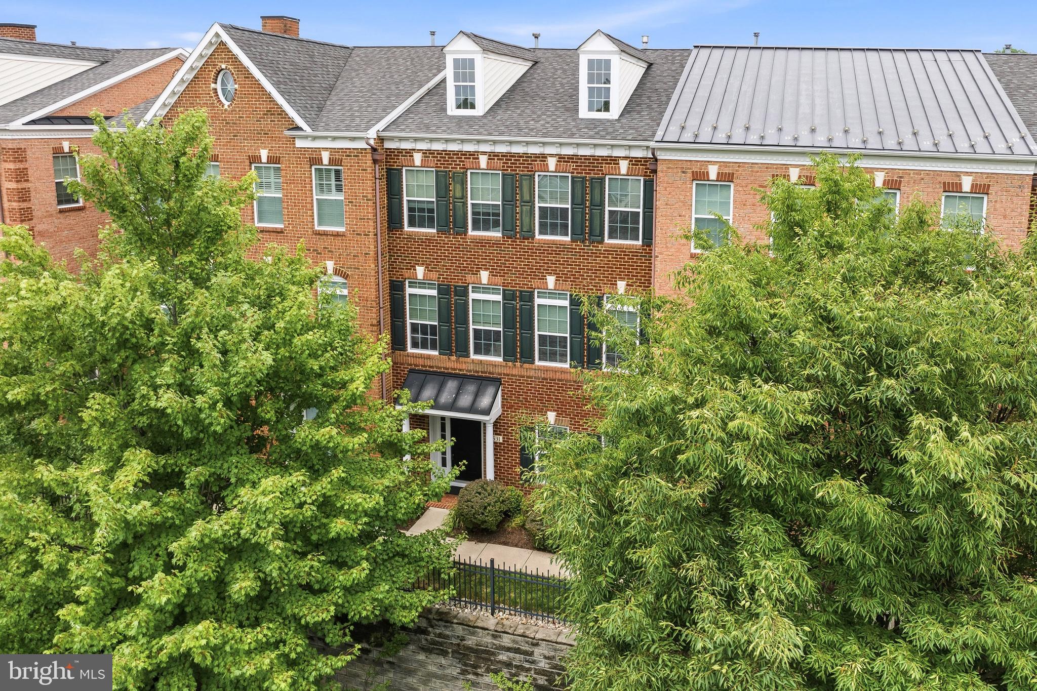 A Three Bedroom, Two and Half Bath West Chester Borough Townhome that feels like its in its own private community. This nook of townhomes sits elevated along West Gay Street in its own fenced neighborhood. A townhouse that offers a classic borough feel with newer touches. Built in 2010, the three-story townhouse provides over 2000 sq ft of living space. A ground floor entrance brings you into a well appointed "family room", a small secondary room that can be storage or even an office and the two car garage. As you ascend to the main living area, you notice a semi-open floor plan with plenty of room for a living room, sitting area, a dining area, a three-sided gas fireplace, a powder room, and a massive Kitchen area, which includes a large eating/sitting area, granite counters, a pantry, large cabinets, and doors to the rear elevated deck. The main level also features great windows and lighting in both the front and rear of the home, which create an amazing, cozy feel. The top floor has three bedrooms. The primary suite is in the rear of the home, with a large walk-in closet and a full primary bath. There is a main hall bath, a full laundry room, and two other bedrooms along the front of the home, all with neutral decor and a clean, fresh look. A home that has everything you'd like within walking distance. The downtown shopping and borough eateries are just blocks away. Multiple parks, Shopping, the West Chester Arts Center, and area schools are within blocks of the home. The beauty of this location is that it is self-contained and feels private while sharing all of the benefits of Borough life, just far enough away to even forget you're in the borough. Parking along W. Gay Street and the surrounding streets is plentiful, and you will thoroughly enjoy being in the borough, with the privacy and beauty of its surrounding neighborhoods. Don't wait to get out and see this one!
