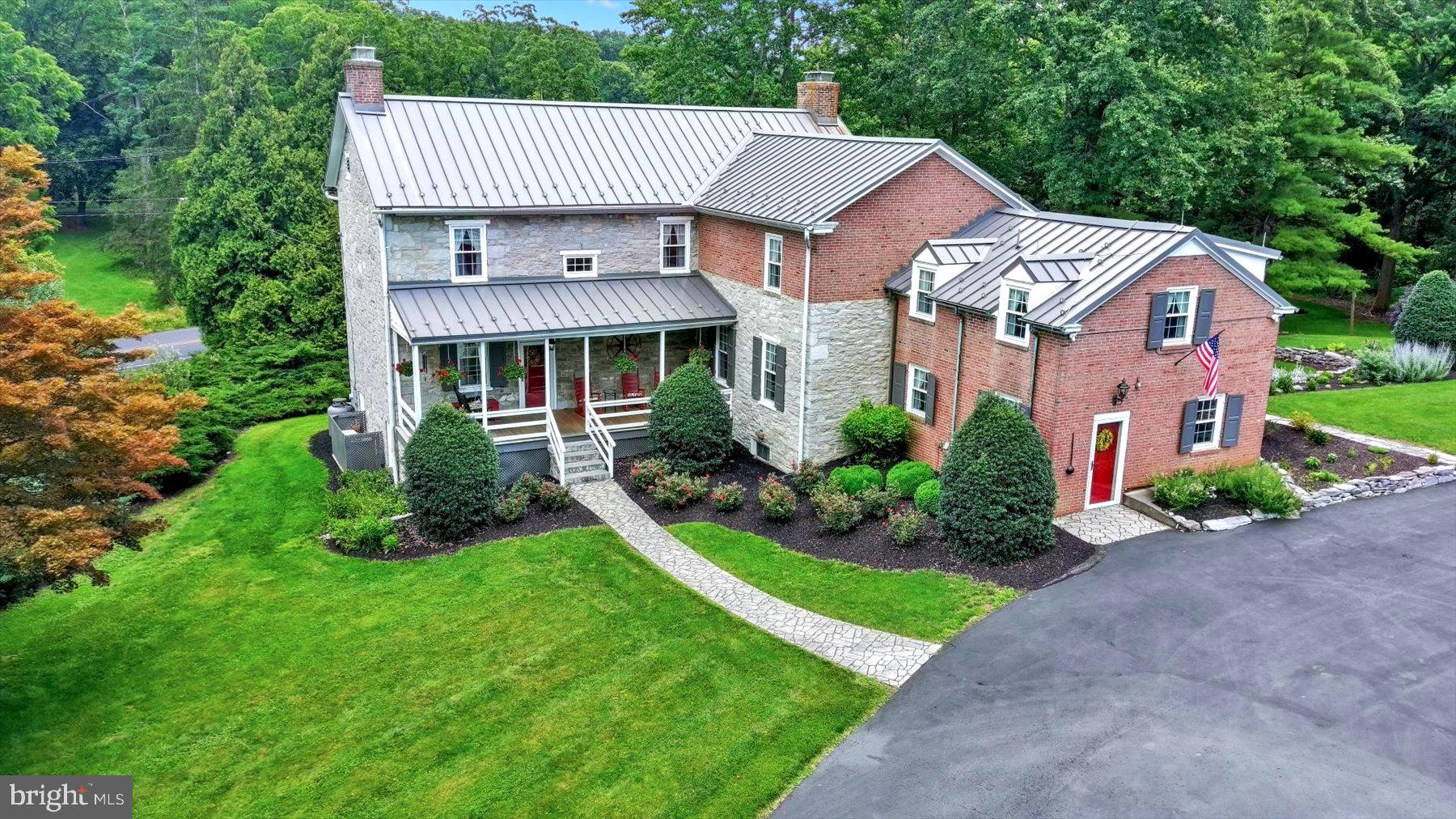The stunning limestone residence country estate has been beautifully updated and is located in a truly breathtaking setting, just two hours north of DC in Historic Carlisle, PA. It is only five minutes away from the U.S. Army War College and Barracks and Dickinson College. A private driveway leads to the entrance of this fully restored country estate, offering a unique opportunity to live in a peaceful countryside setting while still being close to major highways. The home features four bedrooms, a family room, a gourmet kitchen with a sun-filled informal dining area overlooking landscaped stone terraces and a limestone spring-fed pond. The formal dining room is adorned with a historically significant chandelier from President Grover Cleveland’s White House, and a spacious formal living room perfect for entertaining. Original details such as yellow pine flooring, mantels, working fireplaces, ornate woodwork, glass windows, doors & hardware, and a finished basement with a wine cellar add to the home's character. This remarkable property is a rare find - don't miss the opportunity to make it yours!