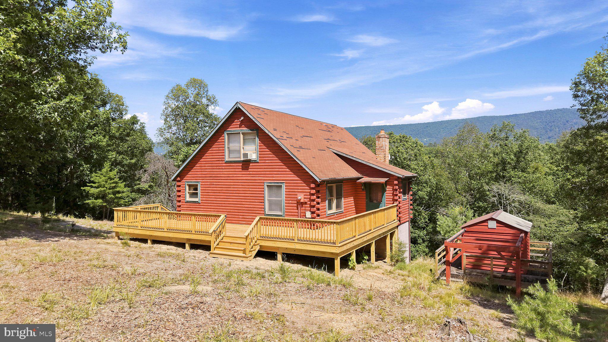 Escape to this charming log home perfectly suited as a full-time residence, weekend retreat, or income-producing vacation rental. Nestled on a quiet, no-outlet road within a gated community, this inviting home offers peace, privacy, and breathtaking forest views from two brand-new oversized decks, creating the perfect setting for morning coffee or relaxing beneath a canopy of stars. For an even more memorable experience, the property includes a dedicated observatory building with a retractable roof, allowing you to set up a telescope or just enjoy exceptional stargazing far from the glow of city lights.
Inside, the open-concept design features a spacious, oversized kitchen that's perfect for entertaining family and friends. Comfort is ensured year-round with a two-zone heat pump system, including one newly replaced in 2024.
Just moments away, enjoy easy access to the community's scenic river, where you can spend the day canoeing or kayaking, then gather at the picnic grounds featuring tables and fire pits for grilling and memorable evenings outdoors.
Whether you're seeking a tranquil mountain lifestyle, a vacation getaway, or a desirable short-term rental opportunity, this beautiful chalet offers the perfect blend of comfort, recreation, and natural beauty.