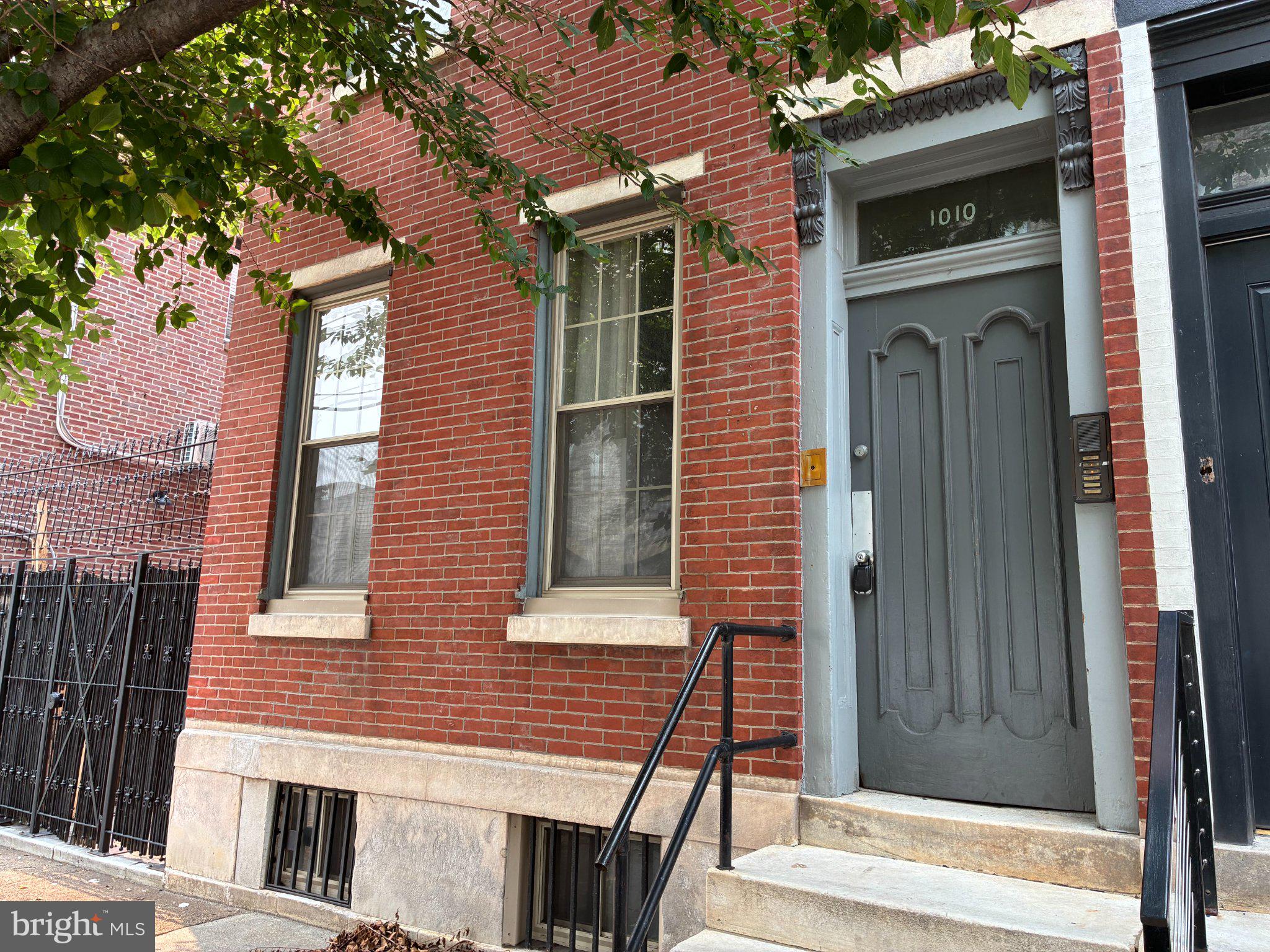 Classic brick-front Philadelphia semi-detached row in highly sought-after Northern Liberties. Large multifamily building with separate utilities. Functional units with some updated kitchens/baths. Layout: front studio, two 1‑bed front units, and a spacious bi-level 2‑bed rear with private entrance, huge yard, and off-street parking. Formerly connected to a renovated non-conforming studio (5th unit) via internal stairs, offering conversion potential. Units feature natural gas boilers, gas water heaters, and mini-split AC. Strong neighborhood appreciation history and upside potential. Offering memorandum available upon request. Listing agent related to owner. Legally a 4‑unit property; non-conforming 5th unit (3R) tied to a separate electric meter that also serves laundry and common lights. All utilities separately metered. Unit 1 (front) — studio; Units 2 & 3 (front) — 1BR; Unit 1‑2 (rear) — bi-level 2BR with private entrance, off-street parking reserved for the rear unit only, and large yard. Unit 3R (non-conforming) — renovated studio. The rear units were previously combined via an internal staircase that could be re-exposed to re-create a tri-level 3–4BR owners suite. Listing agent related to owner. Rent roll, offering memorandum, and renovation details available upon request. Buyer to verify square footage, permits and all information. The financial information presented herein is based on seller-provided operating history and is believed to be accurate but has not been independently verified. Real estate taxes reflect the 2026 tax year. Prospective purchasers should perform their own due diligence regarding future tax assessments and operating expenses. Repairs and maintenance expenses are based on the property's 2025 operating history. Ownership has historically self-managed the property; accordingly, no third-party management expense has been included in the operating statements. Investors should underwrite an appropriate management fee based on their intended ownership and management structure. The property has been maintained as a long-term investment and features a proven rental history. Several units have been renovated over time as they became vacant, with remaining legacy units presenting an opportunity for continued value creation through future renovations and rent growth. The pro forma financials, where provided, are intended to illustrate the potential income achievable through stabilization at market rental rates and should not be construed as a guarantee of future performance. All prospective purchasers are encouraged to independently verify income, expenses, leases, taxes, and all other financial information as part of their due diligence.
