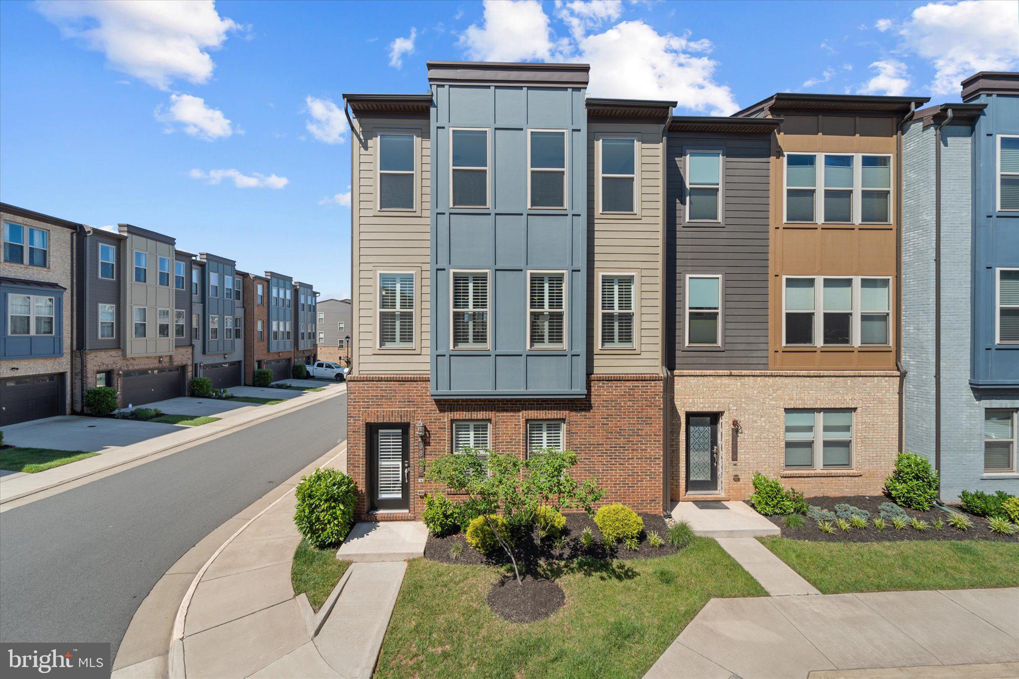**PREFERRED LENDER INCENTIVE AVAILABLE, OFFERING  1% TOWARD BUYER CLOSING COSTS** Built in 2020 and thoughtfully maintained, this end unit townhome offers comfortable living spaces, modern finishes, and a location that keeps everyday conveniences close at hand. This move in ready home offers over 2,400 finished square feet with 3 bedrooms, 2 full bathrooms, 2 half bathrooms, and a rear load 2 car garage. The main living level is open, bright, and welcoming. Natural light fills the space, and the layout allows the kitchen, dining area, and living room to flow comfortably together. The kitchen features white cabinetry, white quartz countertops, stainless steel appliances, a spacious pantry with custom wood shelving, and plenty of storage and prep space. Whether you are cooking dinner, enjoying a quiet morning coffee, or hosting friends for the weekend, the space feels welcoming. A half bathroom is also conveniently located on this level. Sliding glass doors lead to the spacious back deck where there is room to relax, barbecue, or enjoy dinner outside. The awning adds shade and privacy making the space comfortable throughout the year. Upstairs, the primary bedroom offers plenty of room to spread out along with expansive walk-in closets and a private ensuite bathroom with double sinks and a large walk-in shower. Two additional bedrooms, a second full bathroom, and upper-level laundry complete the upper floor. The lower-level rec room offers flexible space that can easily be enjoyed as a home office, workout space, playroom, or simply an extra place to gather with loved ones. A half bathroom and direct access to the two-car garage are also located on this level. Conveniently located near Route 234, Linton Hall Road, downtown Manassas, shopping, restaurants, and commuter routes, this home offers a location that makes it easy to stay connected to everything the area has to offer while still enjoying the comfort of home.