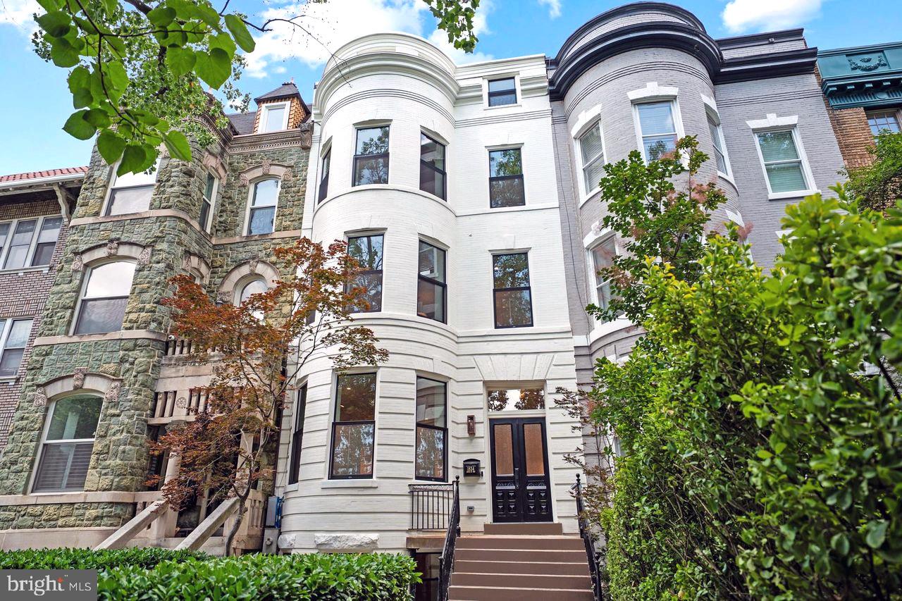 SOPHISTICATED ELEGANCE ON THE AVENUE OF PRESIDENTS

Originally designed by one of the most influential American architects of the late 19th and early 20th centuries, Glenn Brown, and completely renovated in 2025, this exquisitely renovated Victorian masterpiece by the award-winning Dilan Homes seamlessly blends timeless architectural charm with the finest modern luxuries. Positioned just off 16th Street, this 23-FOOT-WIDE residence offers an exceptional living experience, where every detail has been meticulously crafted for both style and comfort.

As you step inside, you're greeted by a grand foyer with striking HERRINGBONE HARDWOOD FLOORS that flow throughout the home. The spacious living room, bathed in natural light, boasts a beautifully designed WOOD BURNING FIREPLACE with custom built-ins—perfect for both intimate gatherings and larger entertaining. Just beyond, a thoughtfully located powder room caters to your guests, while the expansive dining area leads to your chef-inspired kitchen.

The gourmet kitchen is a true showstopper, outfitted with PREMIUM VIKING APPLIANCES—including a six-burner gas range and double-door refrigerator. The striking waterfall quartz countertops, paired with custom soft-close shaker cabinetry and sleek Brizo hardware, elevate the space to new heights of sophistication. The built-in cabinetry offers ample storage, a dedicated wine fridge, and a designated area for a coffee bar—ensuring your culinary pursuits are always supported. A second entry near the kitchen leads to practical rear storage, while the private flagstone patio awaits, offering serene outdoor living and the coveted luxury of TWO CAR PARKING.

On the second level, the primary suite is a true sanctuary, featuring a spa-inspired en-suite bath and a custom walk-in closet designed with custom lighting, shelving, and drawers—creating an ideal retreat for both rest and relaxation. This level also includes an additional bedroom, as well as a conveniently located washer and dryer, ensuring effortless convenience.

Upstairs, you'll find two additional bedroom suites, each complete with expansive closets and en-suite bathrooms. The baths showcase glass-enclosed showers and vanities adorned with Kallista hardware, blending modern style with classic design. A second washer and dryer on this level adds an extra layer of convenience.

The top floor presents an impressive bonus space that can serve as an additional living area, home office, or even an additional bedroom. This level also offers access to the private rooftop deck, an enviable space for outdoor entertaining or quiet reflection while enjoying sweeping city views.

The home's lower level provides a fully functional in-law suite, complete with a separate living area, kitchenette, washer dryer, full bathroom and a bedroom with a walk-in closet. Both interior and exterior access make this level ideal for guests or to be used as additional entertaining space.

Throughout the home, you'll find exquisite wide-plank hardwood floors, curated lighting by Visual Comfort, and hardware by EMTEK—elevating every detail. Located just two blocks from the dynamic 14th Street Corridor, enjoy unparalleled convenience with proximity to Trader Joe's, the Metro, and Meridian Hill Park. A short stroll brings you to celebrated dining destinations, including Le Diplomate and Barcelona, along with an array of shops and entertainment.

This exceptional home combines the best of historic elegance and modern luxury—truly a rare find in the heart of D.C.