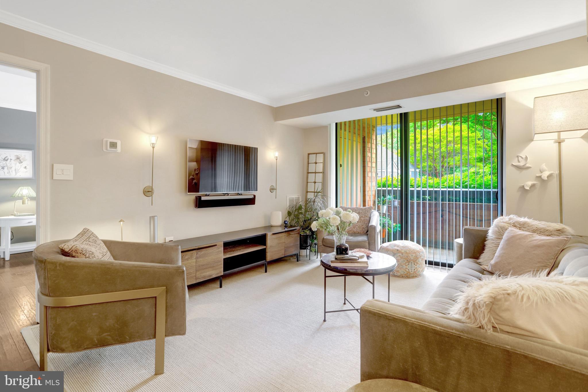 Welcome to 2230 George C. Marshall Drive #305, a beautifully updated 2-bedroom, 2-bath condo with a flexible third bedroom option at The Renaissance at Tysons, a gated, amenity-rich community set on 21 park-like acres inside the Beltway.

Inside, designer elements give the home a warm, elevated feel, from the gorgeous wood floors to the exposed brick accents that add texture and character. The recently renovated kitchen was thoughtfully reconfigured for maximum efficiency and style, featuring new cabinetry, countertops, backsplash, and a smart layout that makes everyday cooking and entertaining feel effortless.

The main living area is open, inviting, and filled with personality, offering plenty of room to relax, dine, and gather. Sliding glass doors lead to an oversized covered balcony, extending the living space outdoors while offering added privacy and near year-round usability.

The bedroom layout is especially appealing, with two spacious suites, each featuring a large walk-in closet and direct access to a full bathroom. The additional flex space can serve beautifully as a den, office, guest room, or potential third bedroom, depending on your needs. A full-size in-unit washer and dryer add everyday convenience.

The Renaissance offers one of the most impressive amenity packages in the area, combining a tranquil, green setting with exceptional convenience. Residents enjoy a year-round swimming pool, three tennis courts, tree-lined walking and fitness trails, a state-of-the-art fitness center with strength and cardio equipment, locker rooms and saunas, meeting and club rooms, a business center, 24-hour security, package services, on-site management, maintenance and engineering support, and abundant resident and visitor parking. The community is also pet-friendly.

One assigned storage bin and one assigned parking space convey, with the opportunity to rent an additional garage space.

With stylish updates, generous storage, flexible living space, and a highly convenient Falls Church location close to Tysons, shopping, dining, Metro, and major commuter routes, this home offers the perfect blend of comfort, design, convenience, and everyday ease.