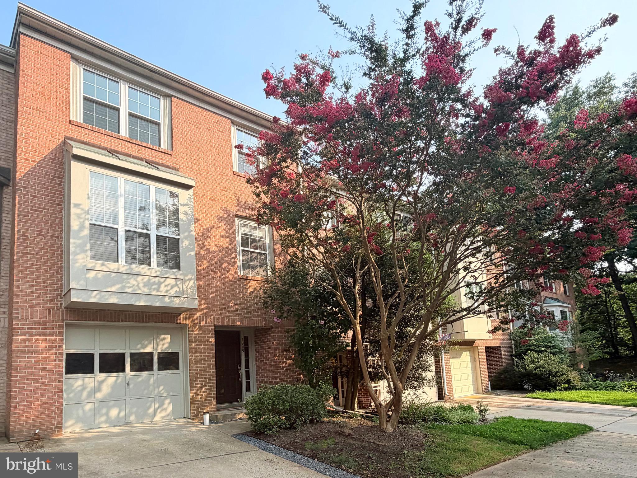 Welcome to this beautifully updated three-level brick-front garage townhome nestled in the highly desirable Woodland Hills community of Gaithersburg. Offering 3 spacious bedrooms, 2 full bathrooms, and 2 half bathrooms, this move-in-ready home combines modern updates with comfortable everyday living.

The inviting main level features spacious living and dining areas, creating an ideal setting for both everyday living and entertaining. At the heart of the home is the beautifully updated kitchen, featuring white shaker cabinetry, granite countertops with a full-height granite backsplash, recessed lighting, abundant cabinet space, a double oven/range, and a stainless steel refrigerator. Whether preparing everyday meals or hosting family and friends, this kitchen is designed to impress.

Freshly painted throughout, the home also features updated bathrooms and three finished levels of versatile living space. The convenient main-level laundry area adds to the home's everyday functionality.

The finished lower level offers endless possibilities as a recreation room, home office, fitness area, or guest retreat. A convenient half bath and direct access to the attached one-car garage complete this level.

Step outside to your private deck overlooking a fully fenced backyard, providing the perfect space for outdoor dining, entertaining, gardening, or simply relaxing in your own private outdoor retreat.

Residents of Woodland Hills enjoy exceptional community amenities, including an outdoor swimming pool, tennis courts, playgrounds, walking paths, and beautifully maintained common areas. The community is ideally located just minutes from I-270, MD-355, the ICC (MD-200), and the Shady Grove Metro Station, offering convenient access throughout the Washington metropolitan area.

Enjoy nearby shopping, dining, entertainment, and everyday conveniences at Rio Lakefront, Downtown Crown, Kentlands, and the exciting Lakeforest redevelopment, one of Montgomery County's most anticipated mixed-use destinations that will bring new retail, restaurants, parks, residential communities, and employment opportunities to the area.

This beautifully updated garage townhome offers the perfect combination of style, comfort, convenience, and location. From its modern finishes and functional floor plan to its outstanding community amenities and proximity to the exciting Lakeforest mall redevelopment, this home presents an exceptional opportunity to enjoy the very best of Gaithersburg living.