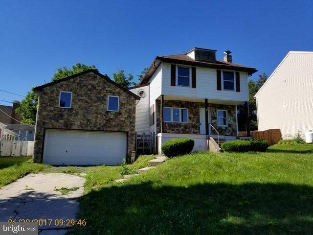Detached 2 bedroom, 1 bath home located on a side street in West Lawn. 2 car garage, rear deck and spacious front porch. Home has potential, in need of much love.