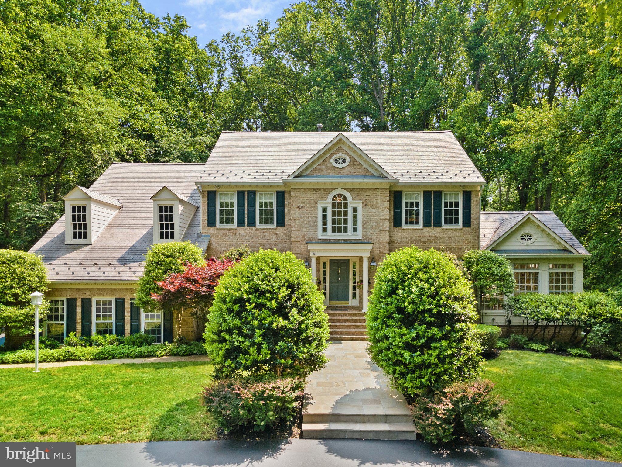 From the moment you arrive at the circular driveway at 11205 Elmview Place, you will know you are somewhere special.  This Grand Colonial combines a traditional exterior with a modern interior offering approximately 6000 square feet of luxuriously finished living space, stunning architectural details, custom moldings, six bedrooms and four and a half bathrooms.  Located in one of Great Falls most sought-after neighborhoods, Old Saybrook.  The setting provides tranquility and wooded views from two decks, landscape lighting, and recently added patio and fire pit.  Nestled into trees for exceptional privacy, only a few minutes drive to the Village of Great Falls, Route 7, and Georgetown Pike.  Sited on just under two acres, with beautiful mature landscaping.   

 

As you enter, a soaring two-story foyer invites light and ambience that continues through the generous floor plan.  The main level is an entertainer’s dream, with hardwood oak flooring formal dining and living room, butler’s pantry, and an open flow from the chef’s kitchen, stepdown family room with stone fireplace (gas fire logs) and wet bar, spectacular sunlit Conservatory room, with direct access to two outdoor decks.  The Conservatory provides a sunlit sanctuary all year round. The large gourmet kitchen includes granite countertops, a large center island, eat-in dining, custom cabinetry, and KitchenAid appliances.  An office with built-in bookcases and a powder room completes this level. 

 

Upstairs hosts 5 bedrooms and 3 full bathrooms, accessed by two stairways. Crown molding, wainscotting and chair rail details are provided throughout. Retreat to your primary bedroom with vaulted ceilings, a spa-like bathroom featuring dual vanities, separate tub and shower, and spacious closets.  A second suite with en-suite bath, and three additional bedrooms provides continued flexible living options. The third bedroom has a cathedral ceiling and Palladian window.

 

A fully-finished private walk-out lower level provides a large recreation room with oak moldings windows and doors, brick fireplace (gas fire logs), guest bedroom, full bath, bar/kitchen, gym, and a temperature controlled wine cellar. Large storage rooms are also provided on this level.

 

Synthetic slate Inspire lifetime warranty roofing tile have been installed, as well as a Blink and EK Pro remote access security system, whole house Generac emergency generator, and R-49 insulation in the attic.  The driveway was just seal coated, and exterior painting was completed in 2020.  There are 3 separate HVAC zones for ultimate comfort.   

 

Located in the desirable Langley high school pyramid. 

 

*Furniture items can be negotiated separately.  Selected items to be retained by Seller.