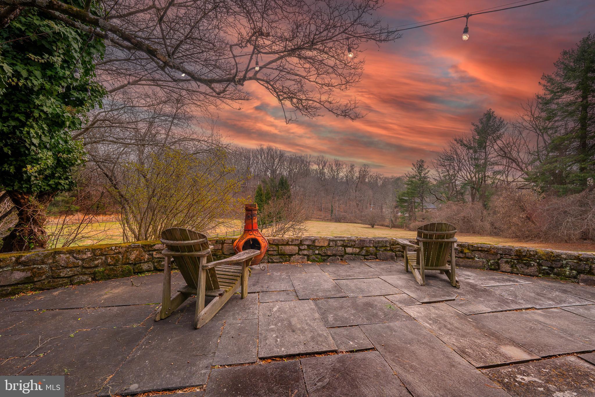 Set along one of Radnor Township’s most picturesque and quietly prestigious streets, this 2.3 acres Boxwood Road property offers an exceptional setting and a rare opportunity. The lot itself is the true asset—generous in scale, beautifully sited, and surrounded by a collection of tasteful, high-value homes representing multiple architectural eras.
The existing 1954 stone Colonial provides a placeholder footprint, offering four bedrooms and three-and-a-half baths, but the value lies squarely in the land and its orientation. The rear of the property faces south, capturing long, uninterrupted wooded views that feel both bucolic and private—an ideal backdrop for a thoughtful renovation, significant expansion, or a complete architectural re-imagining.
Public water and sewer, along with natural gas, are already in place, simplifying the path forward. Boxwood Road is known for its discretion, beauty, and enduring appeal, making this a compelling offering for those seeking a premier Bryn Mawr location and the freedom to create something truly special.