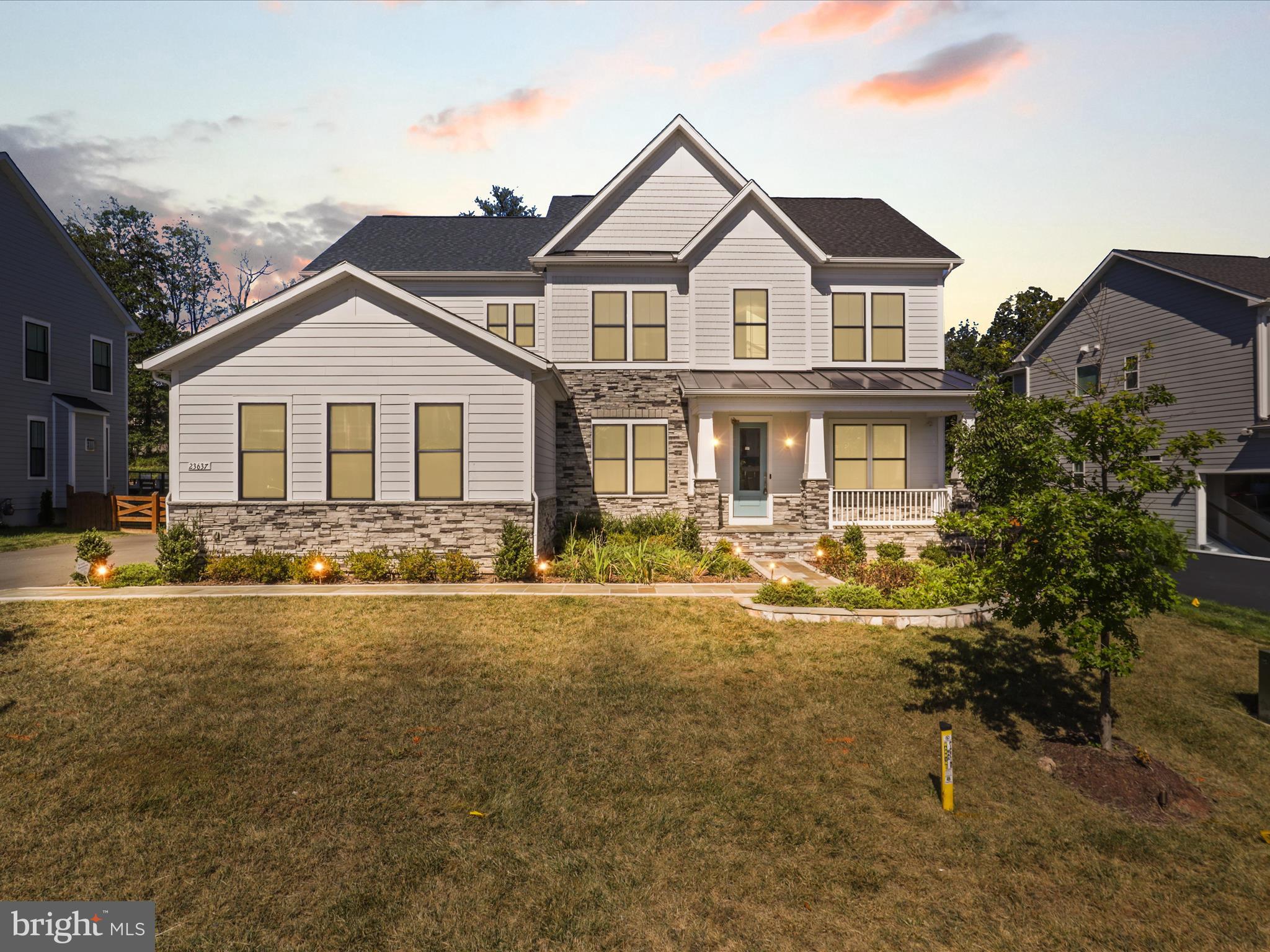 Welcome to the most desirable community in Northern Virginia – welcome to Hartland.  Step inside to the sophisticated DRB Richmond model. Over $200,000+ Worth of Upgrades included. This a modern farmhouse situated on Quarter-acre (1/4) “East Facing”. This stunning home embodies luxury, comfort, and elegance, offering an exceptional living experience for the discerning homeowner. With its impeccable design, craftsmanship, and unparalleled amenities. Situated on a meticulously landscaped lot Backing to woods, This home boasts exquisite curb appeal and an inviting presence. Step inside, and you'll immediately be captivated by the grandeur of the foyer, featuring soaring ceilings and an abundance of natural light. 3 finished levels with almost 6000 finished square feet on two levels, 5 bed rooms and 5.5 baths 3-car Side load garage. The large stone-front porch invites you into a beautifully designed open-concept floor plan, complete with upgraded luxury vinyl plank flooring and exceptional finishes throughout. The main level features a spacious library, a separate dining room. The heart of the home is the gourmet kitchen, beautifully appointed with quartz countertops, floor-to-ceiling cabinetry, custom lighting, and sleek designer touches. Just off the kitchen, the spacious family room features striking coffered ceiling that add warmth, character, and architectural charm. Throughout the home, you'll find luxury vinyl wide-plank flooring on all three levels, elegant crown molding, coffered ceilings, and eye-catching modern fireplaces that elevate each space.. Enjoy easy access from the kitchen/family room to the stunning covered porch, ideal for outdoor entertaining or relaxing and walk down to the stone patio. Upstairs, you'll find 4 spacious bedrooms, 3 full bathrooms, and a separate laundry room for convenience. The large primary suite features a Tray ceilings , dual walk-in closets, a luxurious en-suite bathroom with dual vanities, and a separate two-headed seamless glass shower. The 3 secondary bedrooms are all outfitted with upgraded carpet & 2 additional full baths, and an upstairs laundry room to complete the upper level. The fully finished walkout basement is a remarkable extension of the home’s living space, designed for both recreation and relaxation. A large rec room provides endless possibilities for entertainment and makes hosting effortless. The dedicated media room is perfect for movie nights, and the gym room, allows for convenient at-home workouts. Additionally, the lower level includes a full bedroom w/ a walk-in closet and an attached full bath, making it an ideal guest or au pair suite. An unfinished area provides ample storage. Step outside onto a custom stone patio with expansive backyard and enjoy the serenity of your private backyard oasis. From quiet evenings under the stars to lively summer barbecues, this outdoor space is perfect for making lasting memories with family and friends. Beyond the stunning interiors, this home is further enhanced with an sprinkler system, ensuring lush landscaping year-round. Additional upgrades include , Tankless water heater and furnace humidifier, Fully integrated Security and Monitoring System ,In-Wall Speaker System and Premium Structured wiring, this estate offers an unbeatable location short drive to Old Farm Winery and Hartland Club House.*Premiere Loudoun county schooling*Residents enjoy proximity to picturesque wineries, the expansive Hal and Berni Hanson Regional Park, top-rated schools, premier shopping and dining destinations, and major commuting routes, including Route 50, Loudoun County Parkway, and Old Ox Road. This home is truly a rare gem, offering the perfect balance of privacy, modern luxury and unparalleled convenience.