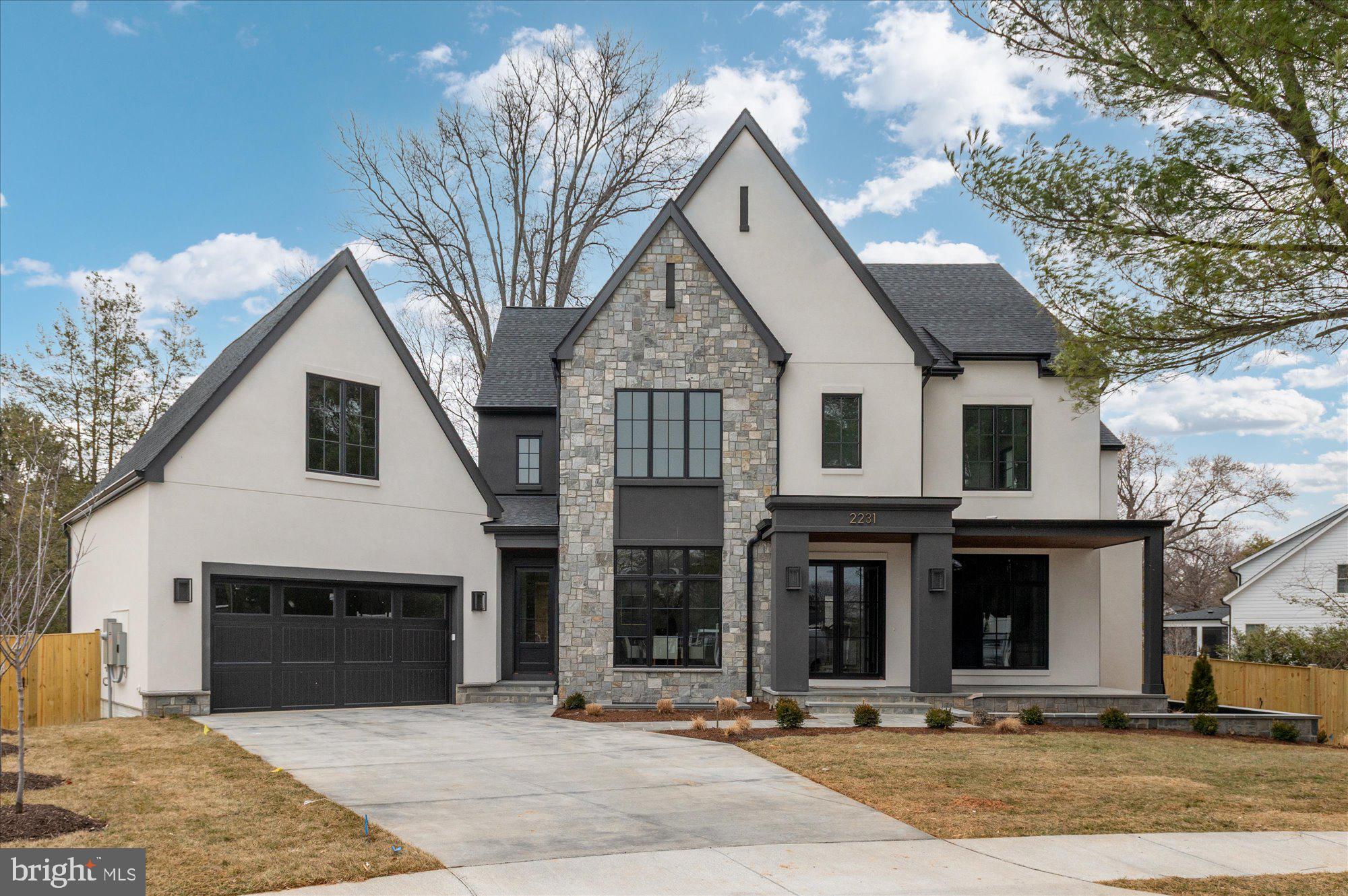 Nestled at the end of a peaceful cul-de-sac, this stunning new construction by Elevation Homes offers refined luxury on a rare flat 0.34-acre lot. Thoughtfully designed by DeFalco Home Design, the home combines elegant architecture, exceptional craftsmanship, and modern functionality in one extraordinary residence.

The residence features six spacious bedrooms, including a private bedroom on the main level—ideal for guests, multigenerational living, or a home office—each with its own en suite full bathroom for ultimate comfort and privacy. Throughout, the home, you’ll find gorgeous 7" engineered white oak flooring, gorgeous Visual Comfort lighting, and refined mill work and detailing. Soaring 10-foot ceilings on the main level and 9-foot ceilings on the upper and lower levels create an open, airy feel that enhances the home’s elegant design.

At the heart of the home, the gourmet kitchen is a true showpiece, featuring a 48” Wolf gas range with six burners and infrared griddle, a 48” Sub-Zero refrigerator, Wolf microwave, and two Cove dishwashers.
The custom-designed kitchen and butler’s pantry cabinetry feature hardwood maple drawer boxes with dovetail joints and soft-close rollout shelving on all base and pantry cabinets.

Enjoy seamless indoor-outdoor living with a screened porch that flows effortlessly into the large family room, creating the perfect space for relaxation or entertaining. The expansive rear deck, spanning the width of the home, offers an additional gathering space overlooking the beautifully landscaped backyard. You’ll find a professionally installed landscaping package, complete with an irrigation sprinkler system and exterior landscape lighting, enhancing both curb appeal and ease of maintenance.

This property exemplifies the quality finishes and meticulous craftsmanship that define Elevation Homes. While located on the border between Falls Church and Arlington, this home feeds into the McLean High School pyramid: Haycock Elementary, Longfellow Middle, and McLean High School. With easy access to major commuter routes and top-rated schools, this unbeatable location offers convenience and luxury to create the ultimate living experience.