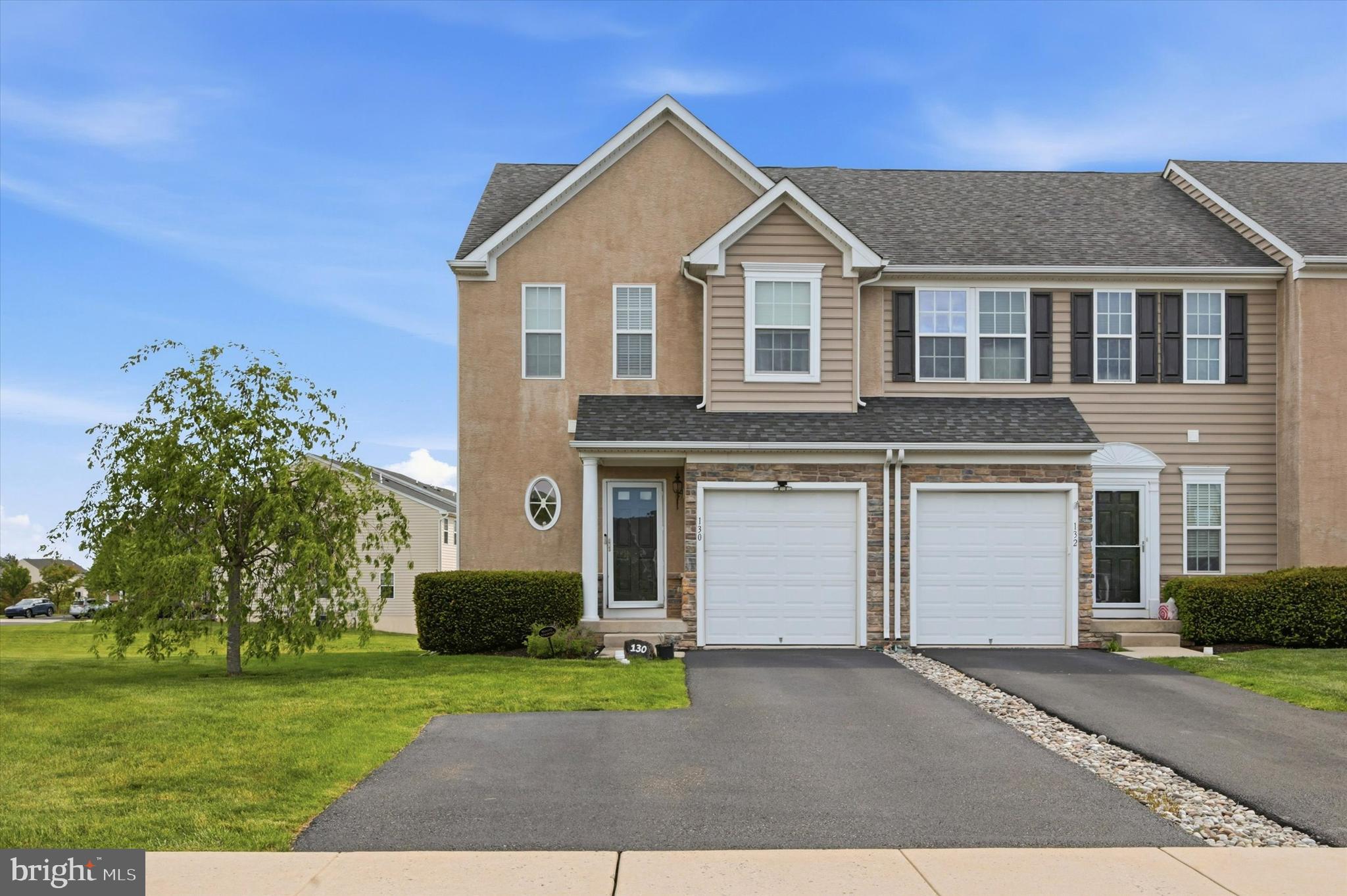 Presenting 130 Fawn Drive, Gilbertsville, PA, a well-appointed end-unit townhome located in the Windlestrae development in New Hanover Township. Offering 3 bedrooms, 2.5 bathrooms, 1,792 square feet of living space, a finished basement, a large deck, and a 1-car garage, this home provides a strong blend of comfort, function, and modern design.

The main level is bright, open, and thoughtfully arranged. As an end unit, the home benefits from additional windows that fill the interior with natural light. The 9-foot ceilings create an open feel, while luxury vinyl plank flooring adds a clean and durable finish throughout the main living area. The layout connects the living room, dining area, and kitchen in a way that feels spacious and practical.

The kitchen features white cabinetry, stainless steel appliances, a center island, and an easy connection to the main living and dining spaces. Whether preparing meals, hosting guests, or enjoying a quiet night at home, this floor plan supports a wide range of everyday needs. A first-floor powder room adds convenience, and direct access to the deck makes indoor-outdoor living simple. The deck overlooks open space behind the home, giving the outdoor area an added sense of privacy and openness.

The second floor includes a comfortable primary suite with an ensuite bathroom and multiple closets. Two additional bedrooms feature ample closet space and strong natural light, while the hall bath includes a tub. The second-floor laundry area is another practical feature that adds ease to daily routines.

The finished basement provides valuable bonus space with vinyl flooring and storage. It can serve as a movie room, office, recreation area, fitness space, or flexible extension of the home. The attached 1-car garage offers secure parking and additional storage options.

Set within the established Windlestrae community, this home is close to New Hanover Township parks such as Hickory Park, Swamp Creek Park, NHT Community Park, and Briar Ridge Park, along with nearby shopping and daily conveniences. With its end-unit position, open space views, bright interior, finished lower level, and convenient Gilbertsville location, 130 Fawn Drive is ready to impress.