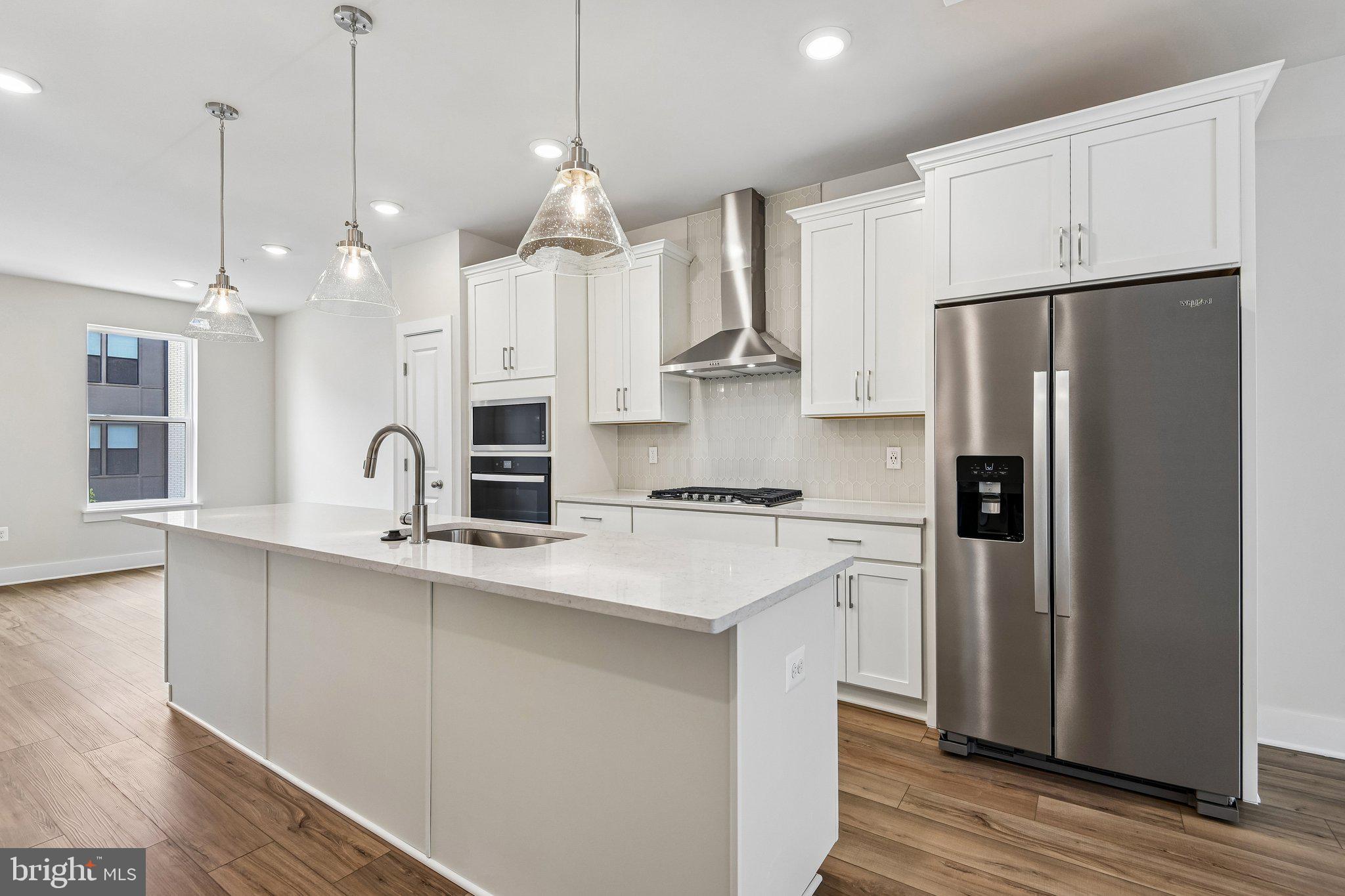 **OFFERING UP TO $45K IN FLEX CASH WITH USE OF BUILDERS APPROVED LENDER AND TITLE.** MOVE-IN READY! An open-concept 4 level townhome with modern finishes and an urban aesthetic! Enter the home through the main entryway or rear load 1-car garage, both of which lead into a spacious lower level with Study and Full Bathroom. Ascending to the second level, you will discover the main living space comprised of a sunlit family room, luxury chef kitchen with an oversized island, the dining room is complete with a sliding glass door and rear deck access. When it's time to relax, retreat to the primary suite, a private getaway that can be found on the third level of the townhome. Spacious by design, this suite offers two large closets and a spa-like bath room complete with a dual sink vanity, private water closet, and shower with bench. The laundry room is also located on the third level, conveniently accessible from the primary suite and secondary bedroom. Enjoy stunning views from the fourth level's loft deck, a private outdoor living area perfect for entertaining. The fourth floor offers a 3rd bedroom and full bathroom, spacious rec room with wet bar. ***THIS PROPERTY MAY QUALIFY FOR THE BROWNFIELD TAX CREDIT. WHICH COULD RESULT IN UP TO A 70% REDUCTION IN ANNUAL CITY PROPERTY TAXES FOR TEN YEARS***