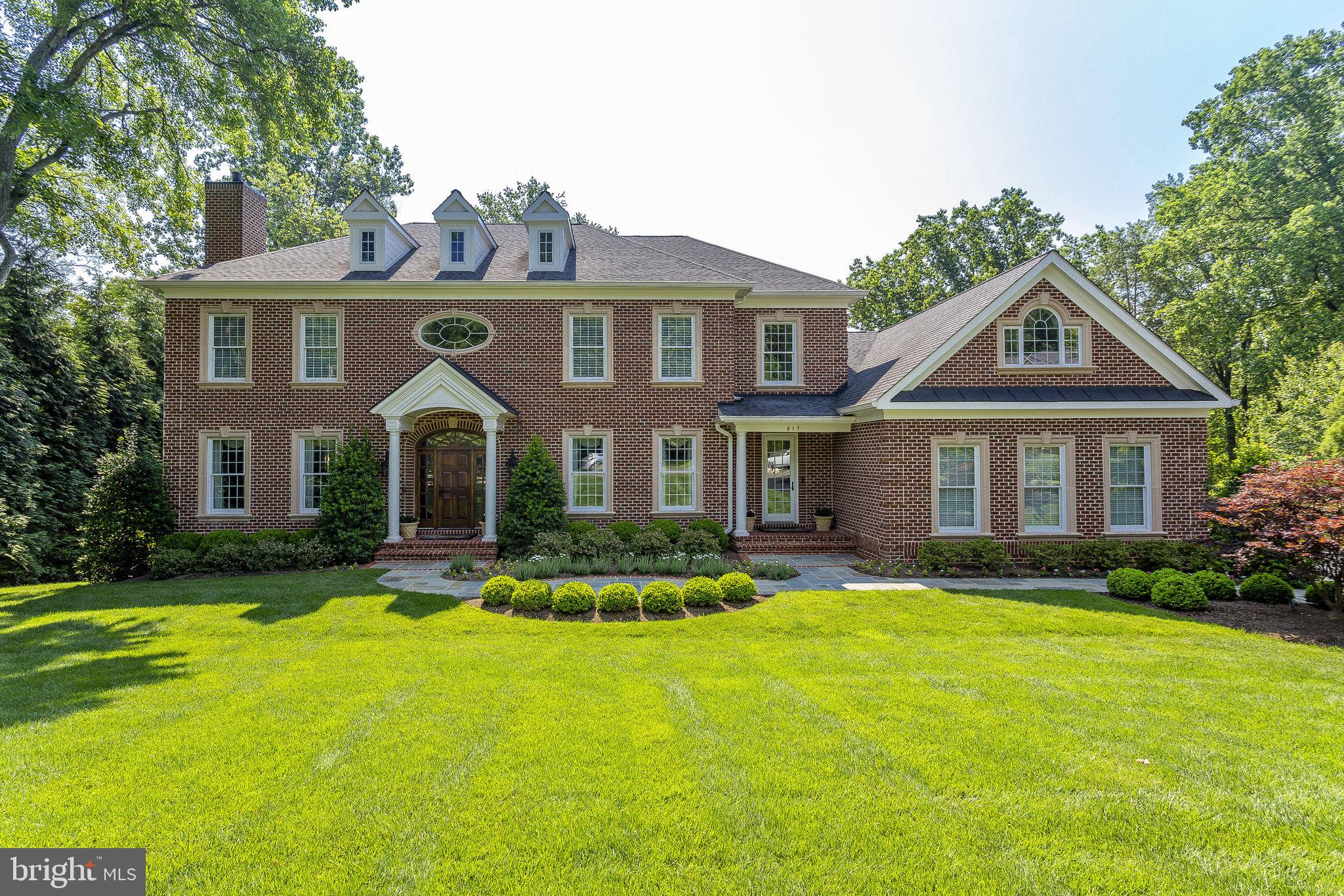Step into a world of  privacy, convenience and luxury with this spectacular Langley Forest estate! Nestled on a pristine 1 ACRE lot, this home is a mere 11 years young and in impeccable condition. Tucked away in a peaceful cul-de-sac and surrounded by lush, mature landscaping, it offers the perfect private oasis with expansive views.

This custom-built beauty boasts 4 sides of brick construction and radiates charm and elegance. As you explore, you'll discover 4 BR's upstairs, each with its own en-suite bath – no more morning bathroom battles! Plus, there's a versatile family room, an oversized bedroom/an additional home office over the garage for whatever suits your family's needs.

Inside, you'll find front and rear staircases, stunning wood flooring, and an abundance of natural light. The traditional living spaces seamlessly blend with the open family room and kitchen, making it an entertainer's dream. Step out onto the oversized maintenance-free rear deck and take in the breathtaking views, or head down to the flagstone patio on the lower level to soak up the privacy.

The gourmet kitchen is a chef's delight, equipped with signature luxury appliances. A regal main-level office with French doors and mahogany walls/built-ins adds a touch of sophistication. With both formal and family living spaces, you'll have room for it all, including a home theater/media room, recreational space, exercise room, and an entertainment bar area. Guest quarters and a family mudroom entrance complete the picture.

But that's not all – this home also boasts a custom-finished 3 car side-load garage. The builder spared no expense on this unparalleled construction, including a state-of-the-art HVAC hybrid system that combines gas and heat pump for ultimate comfort. The R Factor throughout the home is off the charts: 44+ for the roof/ceiling, 30 for the overhangs, 18 for the exterior walls, and a minimum of 13 for the basement walls. The hot water heater features a re-circulator for instant hot water and electronic descaling to keep your pipes clean. And to top it off, there's a generator for added peace of mind.

There are simply too many amazing details to mention! Located in the highly sought-after Churchill, Cooper, and Langley school district, this gem is inside the beltway and conveniently situated for all that DC and Tyson's have to offer. Welcome home to your very own slice of paradise in Langley Forest!