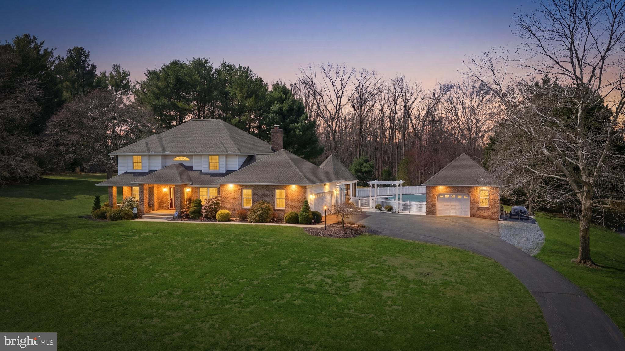 Welcome to 4052 Ganford Court — set on 2.5 picturesque acres in Jarrettsville! With over 4,000 square feet, a heated in-ground saltwater cement pool with diving board and water fountain, and a thoughtfully designed layout with a main-level bedroom and full bath, this 4-bedroom, 4 full bathroom home offers the perfect blend of everyday comfort and exceptional entertaining.
The main level is designed for both flexibility and flow, featuring a bedroom or office, full bathroom, formal living and dining rooms, and an open kitchen that connects seamlessly to a table area and spacious family room with a gas fireplace. The remodeled kitchen stands out with white soft-close cabinetry, pull-out drawers, quartz countertops, stainless steel appliances, and a convenient hot water dispenser. A large, light-filled 3-season room/porch (acrylic windows or screens) extends your living space and provides the perfect spot to relax and take in the surrounding property. Just off the attached two-car garage, a functional mudroom with washer and dryer adds everyday convenience.
An open staircase overlooking the foyer leads to the upper level, where you’ll find three generously sized bedrooms, including a spacious primary suite with a private bath featuring a large jacuzzi tub and separate shower, along with a hall bathroom serving the additional bedrooms.
The finished lower level offers incredible versatility, complete with a full bathroom, bar area with sink and refrigerator, projector and screen, and built-in sound system—ideal for entertaining, game days, or movie nights. There is also unfinished space for storage and utilities, plus a walk-out to exterior egress stairs.
Step outside to your own backyard oasis. The heated saltwater cement pool, complete with diving board and water fountain, creates a true backyard retreat surrounded by privacy and open space. The expansive 2.5-acre lot offers endless possibilities, while the detached one-car garage provides excellent space for a workshop, additional storage, or housing lawn equipment, bikes, and more—complete with dedicated pool storage room and a floored attic space. An attached two-car garage adds everyday convenience.
Major updates include a new roof (2024), HVAC system (2025), and hot water heater (2026), offering peace of mind for years to come.
A rare opportunity to own a turn-key home with space, updates, and standout outdoor living in a peaceful Jarrettsville setting.