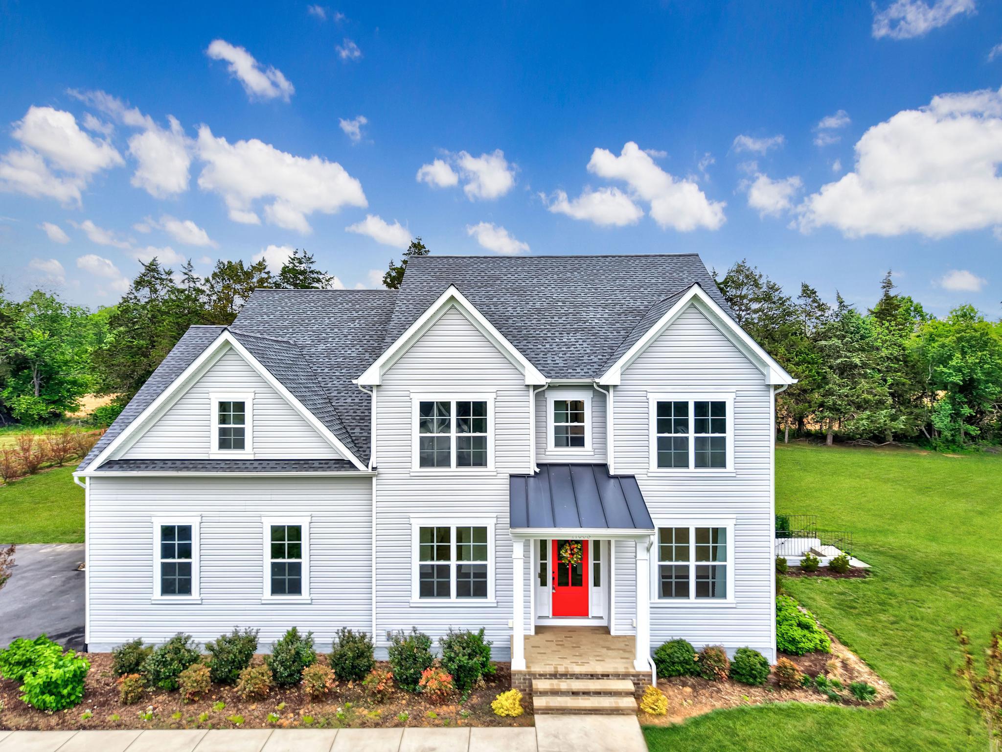 ***3.75% VA Assumable loan available to eligible Veterans.*** Perfectly situated on two private acres in sought-after Thorburn Estates, this stunning 2022 semi-custom-built Colonial blends modern luxury with timeless design across nearly 5,000 square feet of beautifully finished living space. From the moment you arrive, the home’s impressive curb appeal, side-entry three-car garage, and welcoming front porch create an unforgettable first impression. Inside, the open-concept main level floor plan is filled with natural light and thoughtfully designed for both everyday living and effortless entertaining. Wide-plank flooring, recessed lighting, and new light fixtures, along with designer details elevate every room. The home's chef will love cooking in this kitchen, which features GE Cafe stainless steel appliances, abundant cabinetry with above-and-below lighting, a farmhouse sink, expansive quartz countertops, a huge center island that comfortably seats six bar chairs, a separate beverage fridge, and a walk-in pantry. The gourmet kitchen flows seamlessly into the spacious living room, which is perfect for gathering and entertaining. This area offers views of the tree-lined backyard and a cozy fireplace. The main level also boasts a spacious bedroom with an attached full bathroom - great for someone who doesn't want to use the stairs. A private home office with french doors, an elegant dining room, and a full bathroom complete this level. Upstairs, the home offers four generously sized bedrooms and three full bathrooms. You will love your luxurious primary suite, which features a huge walk-in closet and a spa-inspired bathroom complete with a frameless, walk-in shower and soaking tub. The laundry room is conveniently located on the upper level as well. A fully-finished, walkout basement adds exceptional flexibility with additional living and entertaining space. It features a built-in countertop with a sink and mini refrigerator, guest accommodations including a room and full bathroom, a huge recreation area, and a storage room that already has a radon remediation system in place. Enjoy grilling and entertaining on your back patio. It's also been a favorite spot for watching wildlife and enjoying the sunsets. The cherry trees on the property add to the serene setting. Conveniently located near shopping, dining, commuter routes, and within the Riverbend High School district, this exceptional property delivers the perfect combination of space, style, and modern comfort.