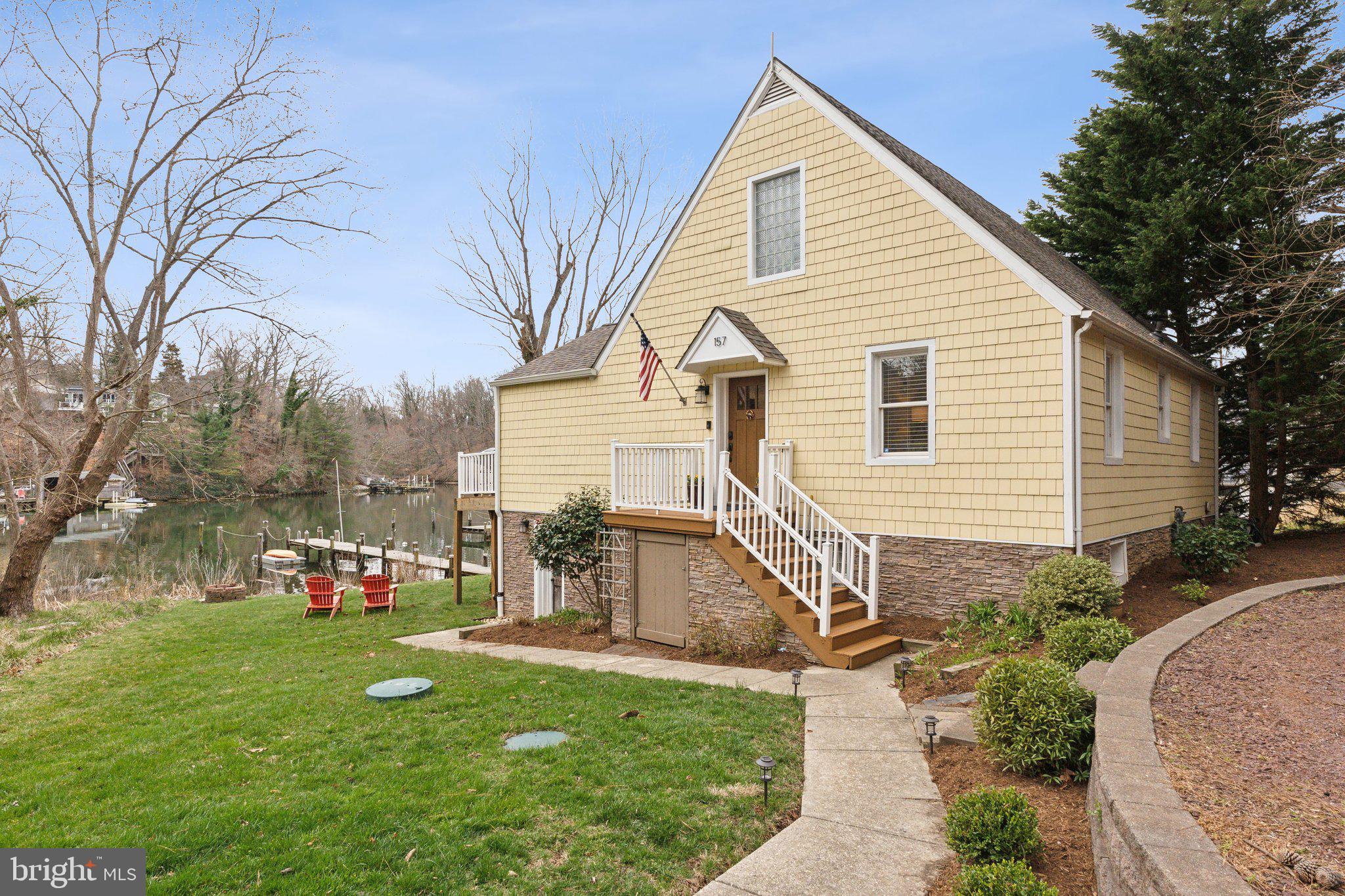 Welcome to 157 Edgeway and say hello to all of your waterfront dreams!!  Perfectly located in a quiet cul-de-sac in the coveted community of Pines on the Severn AND perfectly located on the water in a beautifully protected and nature-rich cove!! You will immediately feel at home upon entering and will immediately be impressed by the space and natural light that flows through the home. The main level features an updated kitchen with an oversized island that adjoins perfectly with the family room, dining area, and the oversized waterfront deck. Entertaining will be a breeze, and your only problem will be getting people to leave!! Also on the main level are 2 light-filled bedrooms and a full shared hall bathroom. Prepare to be impressed and taken to a calmer place as you head upstairs to the primary retreat with a private waterfront balcony. You will feel like you are on vacation every day!! Once you step away from the picturesque views, you will notice a beautifully sized primary bathroom with a walk-in rain shower, dual vanities, and a soaking tub. The fun continues as you head down to the lower level - you simply can't call this a basement, as it is a full walkout with tons of natural light and space galore to utilize however your heart desires. The lower level also has another bedroom and an adjoining full bathroom - did we mention guests not leaving....  Homes like this don't come on the market very often, especially this market!!  Don't hesitate, as this is priced perfectly and will not last long!!!