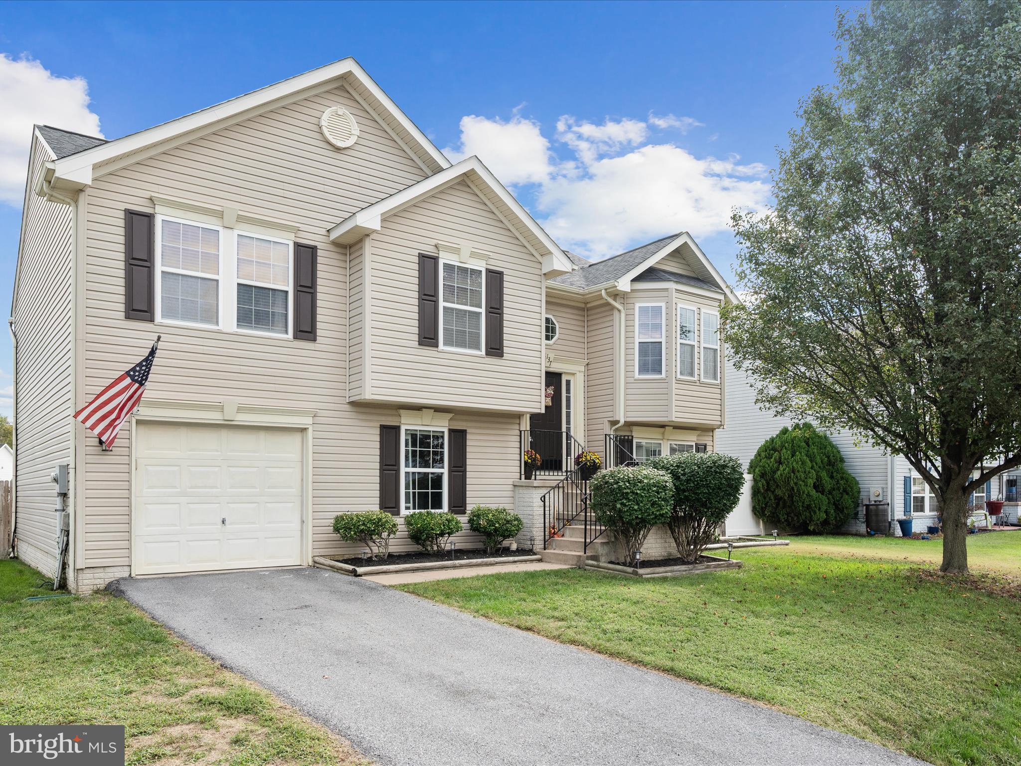 Beautifully updated split-level home in a sought-after Martinsburg location! 137 Charlotte Court offers modern finishes throughout, including updated flooring, a stylish kitchen, and the convenience of a washer/dryer on the main level. Enjoy outdoor living on the Trex deck overlooking a fully fenced backyard that backs to the community common area. The unfinished basement provides excellent storage or potential for future expansion. This home is ideally located with easy access to WV-9 for commuters. Move-in ready and packed with value, don’t miss this one!