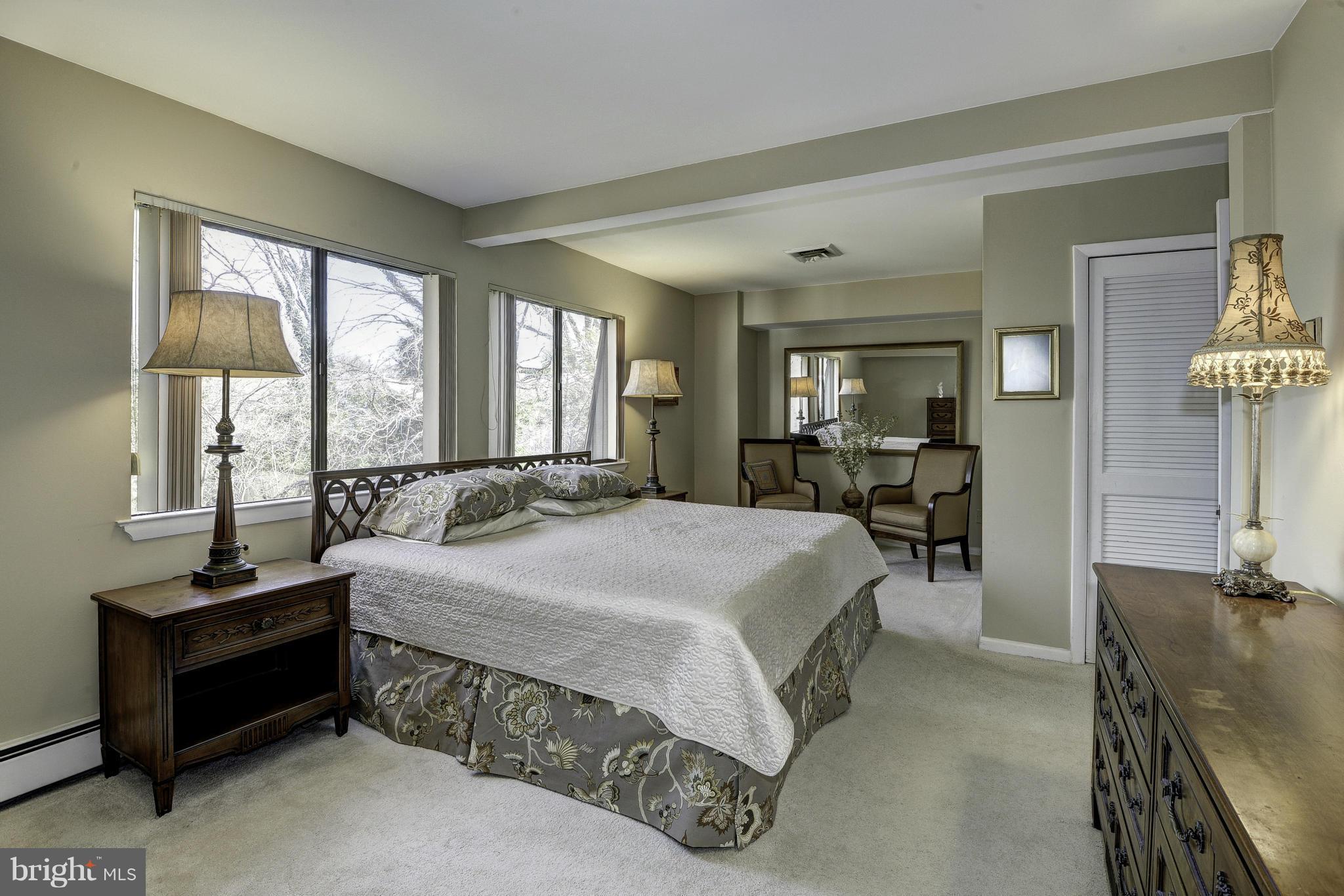Commuters delight! Flexible, sun-filled flrpln w/ updtd ktchn, grnite & chery cabtry. Mstr bdrm w/sttng rm & frmlss glass, & mosaic tiled flrs in bth. Lwr Lvl  above grade & bright w/ handcp side entrnce w/ concret wlkwy, huge casual living area & lrge 2nd mster ste w/ hallwy full bth. Lrge deck w/ steps to private wooded bck yrd. No thru street, cul-de-sac. 3.25 miles to DC