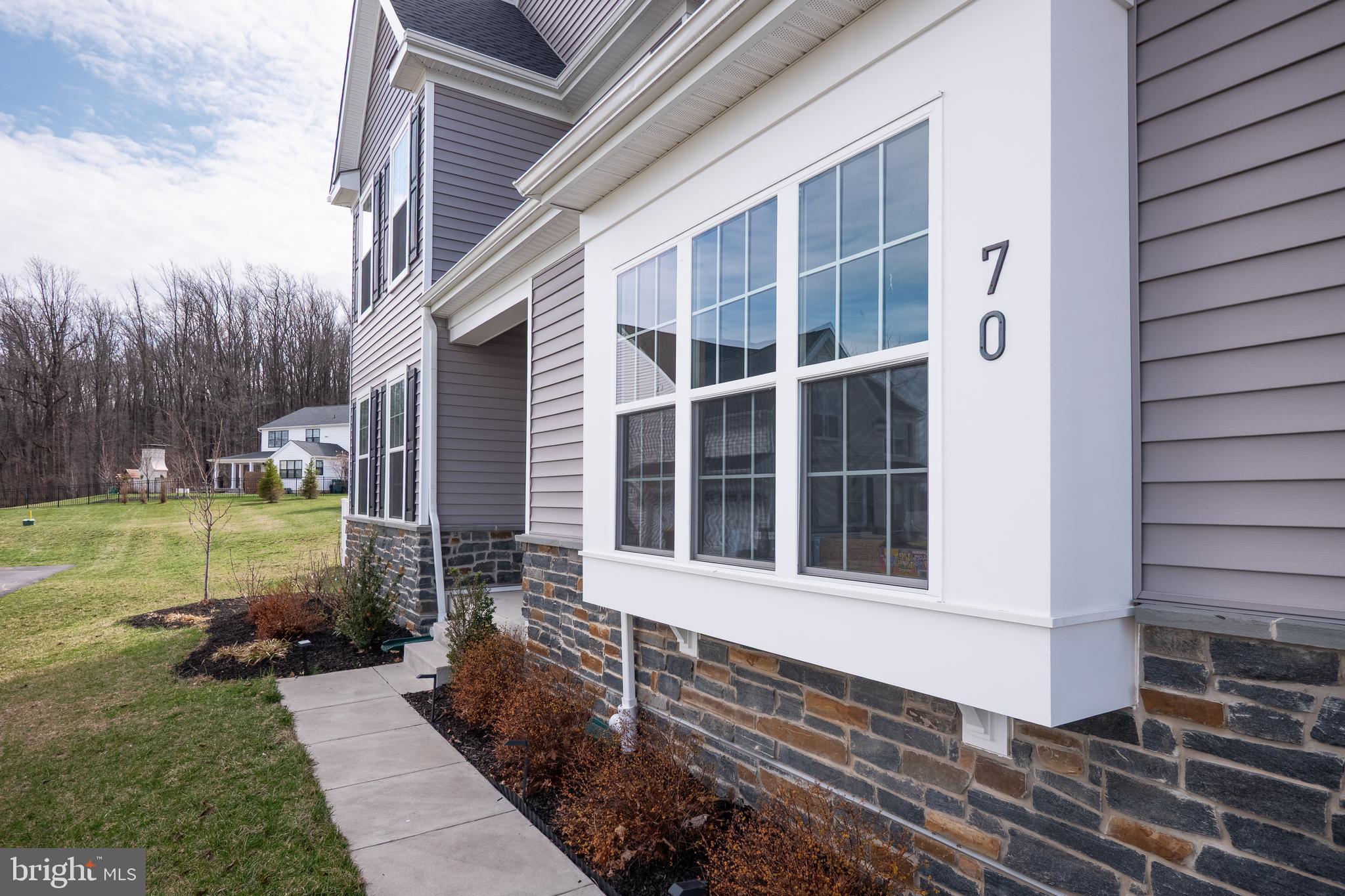 Thoughtfully upgraded, well maintained, and just minutes to I-78, where you’ll enjoy easy access to both Manhattan and Philadelphia in only 90 minutes. This 2023 home features wide plank LUXURY VINYL FLOORING for a seamless, inviting feel. A light-filled SUNROOM offers a perfect spot to relax, while a LARGE BACK DECK with both a COVERED and OPEN AREA equipped with a GAS CONNECTION for your BBQ grill extends living outdoors. The backyard is FULLY FENCED giving you privacy. A MAIN-LEVEL FULL BATH adds convenience and connects to a study that can serve as a guest room or bedroom. The kitchen features grey cabinetry, a blue island, quartz countertops, tile backsplash, and pendant lighting, with Whirlpool double ovens, a gas cooktop, and a Samsung refrigerator, completing this well-appointed kitchen. Additional upgrades include a 3-STAGE WATER FILTRATION SYSTEM and BLINDS THROUGHOUT, and a 3-CAR GARAGE. This home is move-in ready. The unfinished lower level offers ample storage and is PLUMBED FOR A BATHROOM, allowing for customization. A recent home inspection report is available upon request.