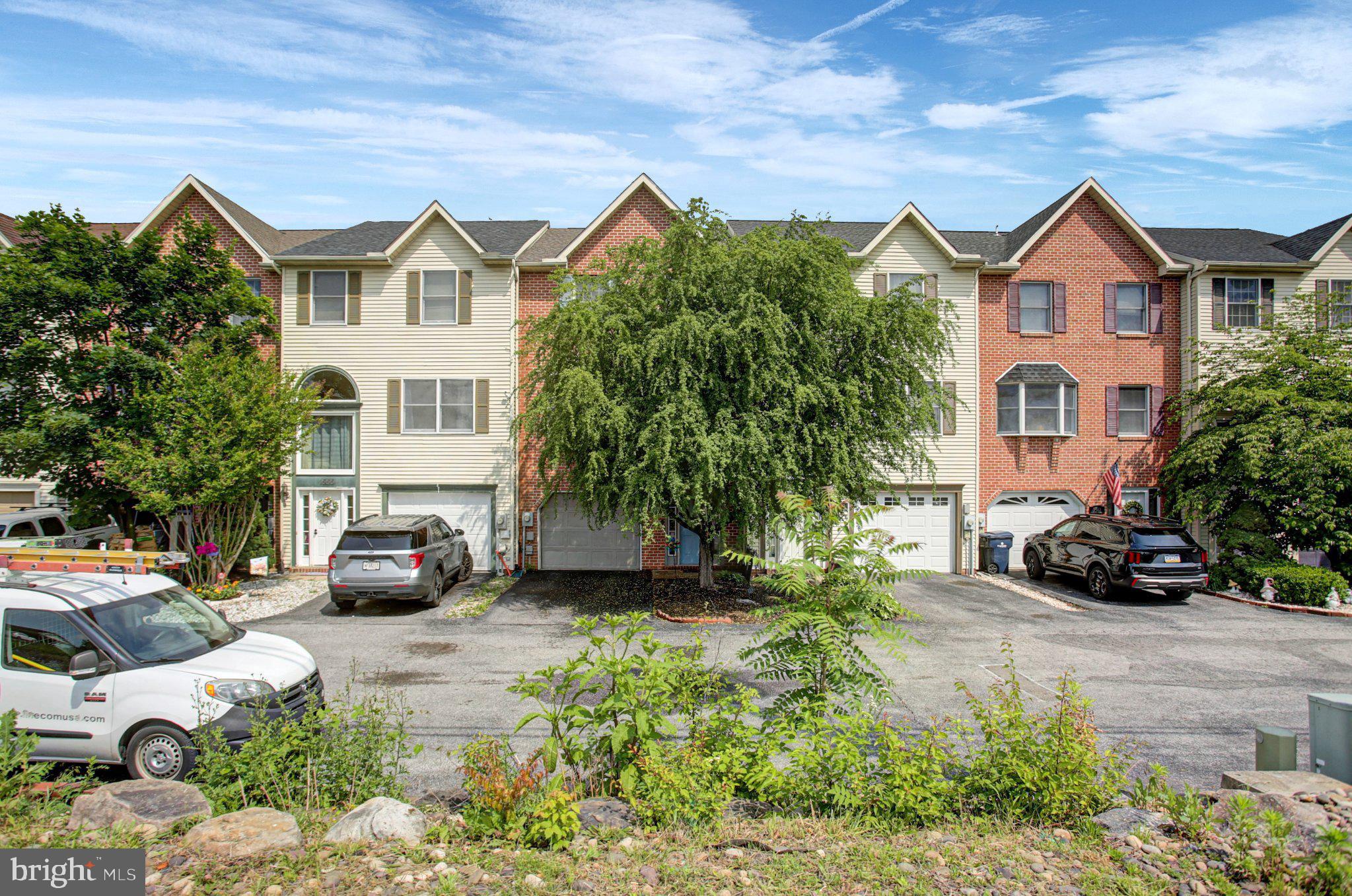 Mountain views, modern updates, and low-maintenance living await at 1557 Brechbill Road! This beautiful 3-story townhouse features 2 bedrooms, 2 full baths, and 2 half baths in one of Chambersburg's most peaceful and picturesque settings. Wake up to stunning views of the Blue Mountains and enjoy spacious living areas, a spectacular kitchen with abundant cabinetry, and stylish new luxury vinyl plank flooring throughout. 

The entry level features a versatile living area and a half bath, and direct access to the backyard through a patio door. On the 2nd floor is the main living room, dining area, kitchen, and an additional half bath. Here, you can step out to a rear deck overlooking the peaceful backyard adorned with trees and a view of the Blue Mountain range, particularly in the winter when trees shed off their leaves. The 3rd floor offers two large bedrooms with walk in closets and two full bathrooms. One of the bedrooms is a comfortable primary suite. Enjoy a spectacular view of nature from the primary suite window! This home is a classic for nature lovers.

Recent improvements include a newer roof, new HVAC system, and newer appliances, allowing you to move in with confidence. Combining comfort, convenience, and scenic beauty, this exceptional home is ready to welcome its next owner.