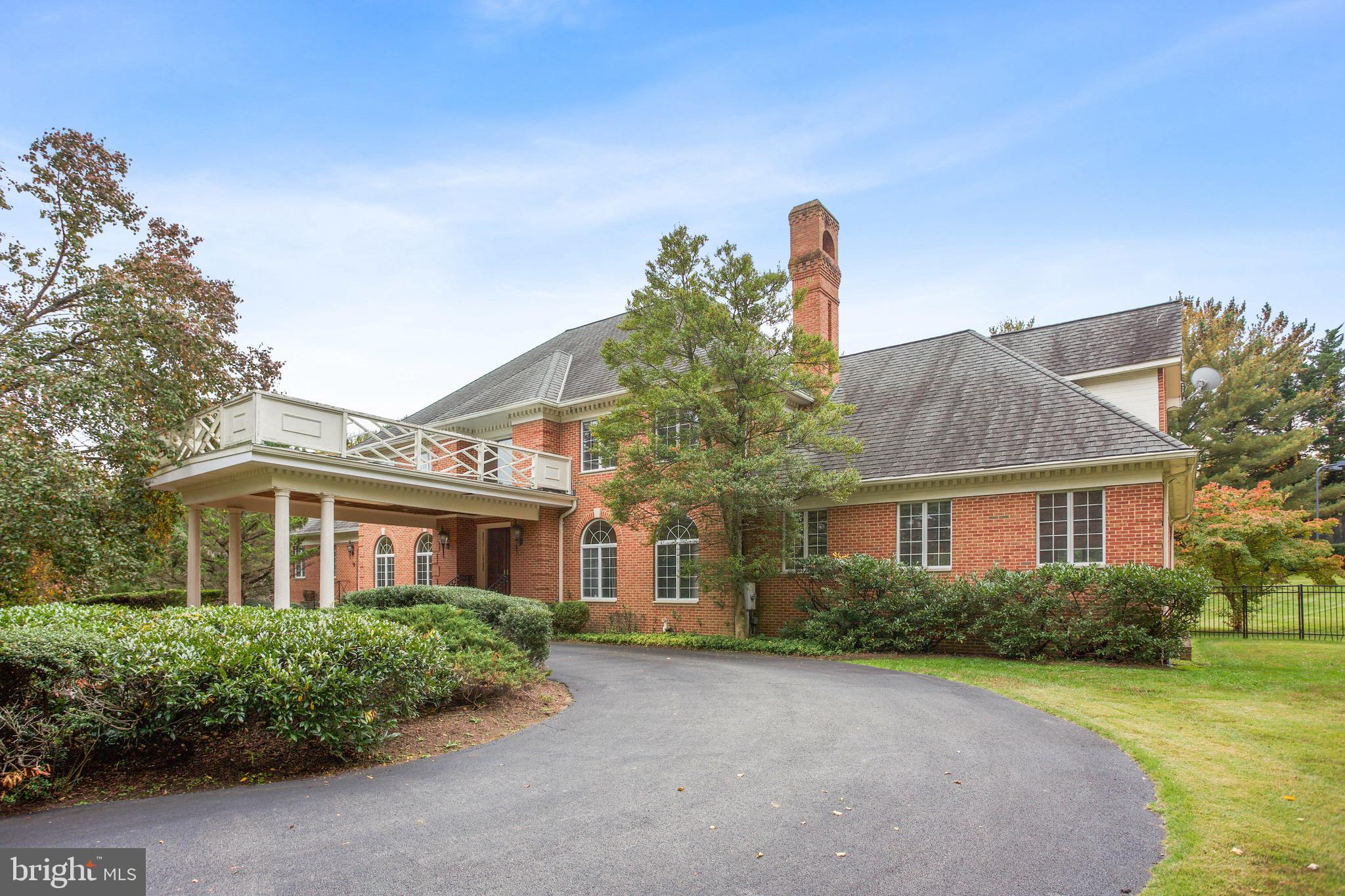 Elegant and expansive, this eight bedroom, seven and two half bath home sits on a rolling two acre lot complete with a tennis court and swimming pool. A gracious porte-cochere leads to grand front doors opening into a two-story foyer with a custom-built curved staircase. The modern floorplan allows for great flow with an inviting family room with soaring ceilings and a fireplace, sun filled formal living room, spacious dining room, office with built-in cabinetry and generously proportioned chef's kitchen all easily accessed from the foyer. A sweeping family room with direct access to the yard and natural light from three exposures and a two-bedroom suite round out the main level. The upper level features the primary suite with a fireplace, large en-suite bathroom and two walk-in closets as well as four additional bedrooms all with ample closet space and three full bathrooms. The lower level is extensive and offers several entertaining areas including a large recreation space and theatre room. A bedroom that could double as an office, a large kitchenette, two and one half bathrooms and access to the three car garage are all located on this level. Situated in the coveted Kentsdale Estates neighborhood, this extraordinary property puts the Potomac Village, some of the area's top public and independent schools, and several highly convenient commuter routes all within easy reach.