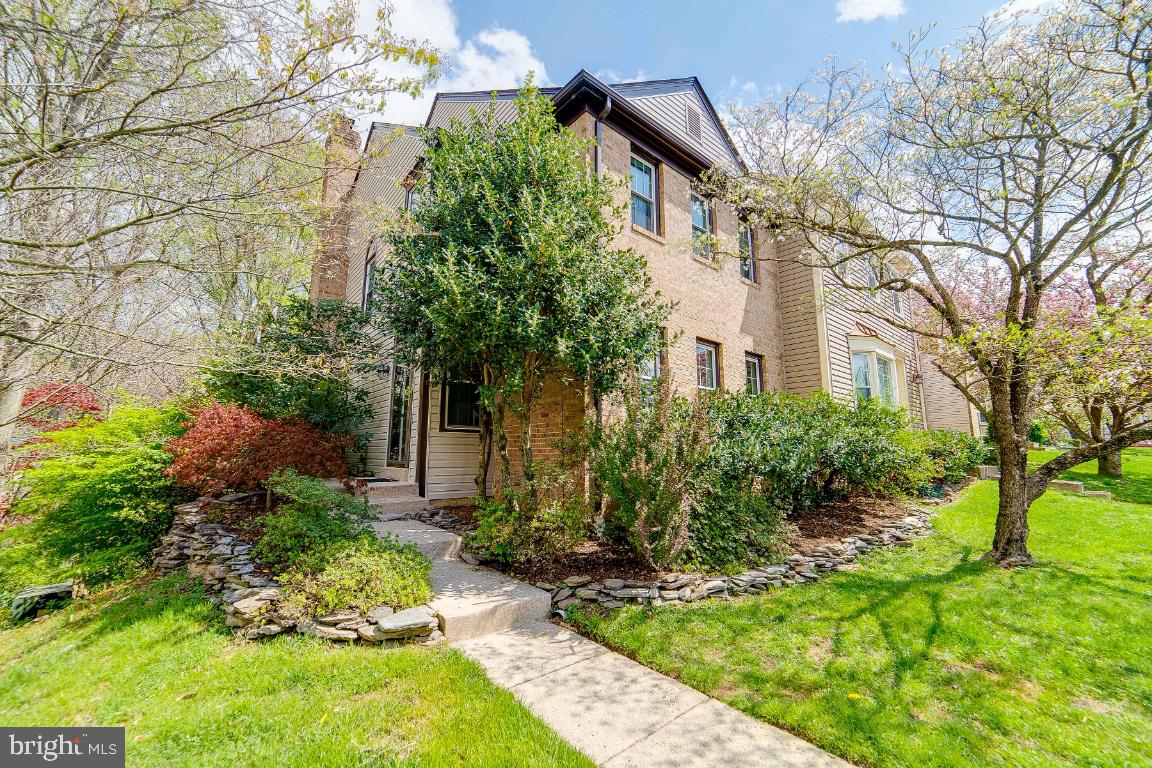 Beautiful, private, and updated end-unit townhouse in the Carriage Gate Cluster of Reston.  An open floor plan on the main level features a sun-drenched living room and dining room in the afternoon.  The kitchen is designed to work well for the chef that enjoys an island and a built-in area for cookbooks, a workstation, and casual dining that connects to the private deck.  Brand-new stainless-steel appliances just installed and good counter space with backsplash/tile. The deck overlooks a wooded area and offers a serene view. Half bath on the same level for guests.  The upper level has the three bedrooms and two full baths.  The primary bedroom has a separate sitting area and a large walk-in closet.  The primary bathroom has a dual vanity and is separate from the bath. Nice appointments to decorate the stairway leading to the upper level.  The fully finished lower level is warm and welcoming with natural light and a wood burning fireplace in the recreation room and a bonus room used as an office or workout room. Brand new carpet and fresh paint throughout the home on all levels! Reference the documents for all upgrades and updates in the home.  The corner lot is tucked away in the back of the neighborhood with a lower-level patio and garden which is fully fenced and accessed by a slider from the recreation room.  The home has adjacent access to footpaths and Lake Audubon.  Shopping and restaurants on Lake Thoreau are half a mile away.  Wiehle Metro is 1.5 miles away and great commuter access to Dulles Toll Road to DC and Dulles airport, Tysons Corner, and Reston Town Center which offers many restaurant, entertainment and shopping choices. You have the option to join the Reston Association and their amenities which include outdoor pools, tennis, playgrounds, and miles of pathways.  If you’re looking for a lifestyle that gives you privacy at home with the ability to entertain friends, along with quick access to fun options around you, this is it!
