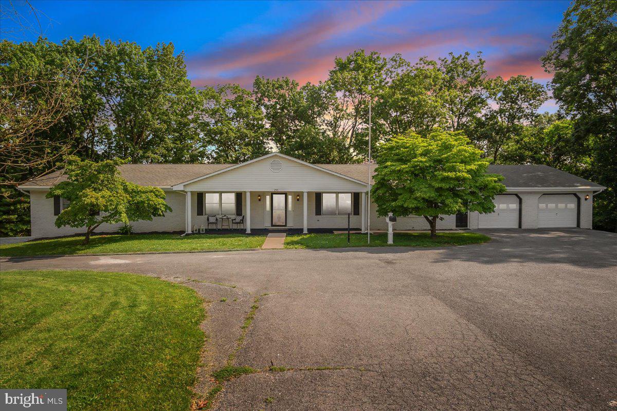 OFFER DEADLINE: SATURDAY, JULY 5TH AT 12 PM. RARE OPPORTUNITY to purchase an exceptional CUSTOM ranch style home with over 4,000 SQ. FT. OF FINISHED LIVING SPACE on over 2 ACRES, located in a PRIVATE cul-de-sac. The MAIN LEVEL alone has 3,200 sq. ft. of finished space with SPACIOUS rooms throughout, such as an 18’ x 14’ Living Room, a 39’ x 11’-4” glass enclosed SOLARIUM, a 20’ x 15’ FAMILY ROOM, a 30’ x 15’ Owner’s Bedroom and other large rooms. Significant upgrades include VINYL PLANK FLOORING on most of the main level, an UPSCALE KITCHEN including cherry cabinets with new QUARTZ countertops and MOSTLY NEW APPLIANCES, a true LUXURY OWNER’S BATHROOM and renovated hall bathroom.  The master bathroom offers new ceramic tile floor,  new freestanding soaking tub, new tile shower with new glass door, and vanity offers new quartz counters. The main level includes 3 bedrooms, that includes two OWNER'S BEDROOM SUITES and 3 full bathrooms. Brand NEW CARPET was just installed in two bedrooms with vinyl plank flooring in the other main level bedroom.  You will love the huge solarium with twelve, 6’ tall CASEMENT WINDOWS overlooking the TREED REAR YARD. The lower level includes a 20' x 15' Recreation Room and a huge 4th bedroom that measures 30' x 14'. Plus, the entire house was just professionally painted. The heat pump is only 5 years old and the roof 10 years old. The OUTDOOR LIVING SPACE is unbelievable with a 63’ x 21’ DECK, a 38’ x 11’ SCREENED-IN PORCH, a 32’ x 8’ COVERED FRONT PORCH and also an 11’ x 11’ screened GAZEBO with a concrete floor. There is an oversized 2-CAR GARAGE on the main level that is 30’ x 28’ and a separate 3-CAR GARAGE on the lower level. You will fall in love with everything this home has to offer.