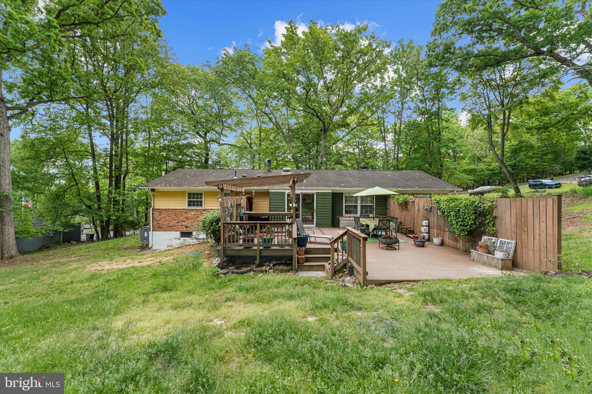 Looking to escape the rat race, look no further!  This home is situated on 1.87 acres of privacy, serenity and beautiful wildlife, on a cul-de-sac with great neighbors and a wonderful community.  Its a short distance to the clubhouse where you can find picnic tables, a firepit, playground, and a basketball court for residents only. 
This home has 2,640 sqft with 3 beds, 2 full baths and a blank slate of a basement to turn into a man-cave, she-cave or whatever your heart desires.  Newly remodeled kitchen that walks out to a private deck where you can grill out and enjoy watching nature.  If you are looking for a true sanctuary of a home, then you must come see this one, you won’t be disappointed."