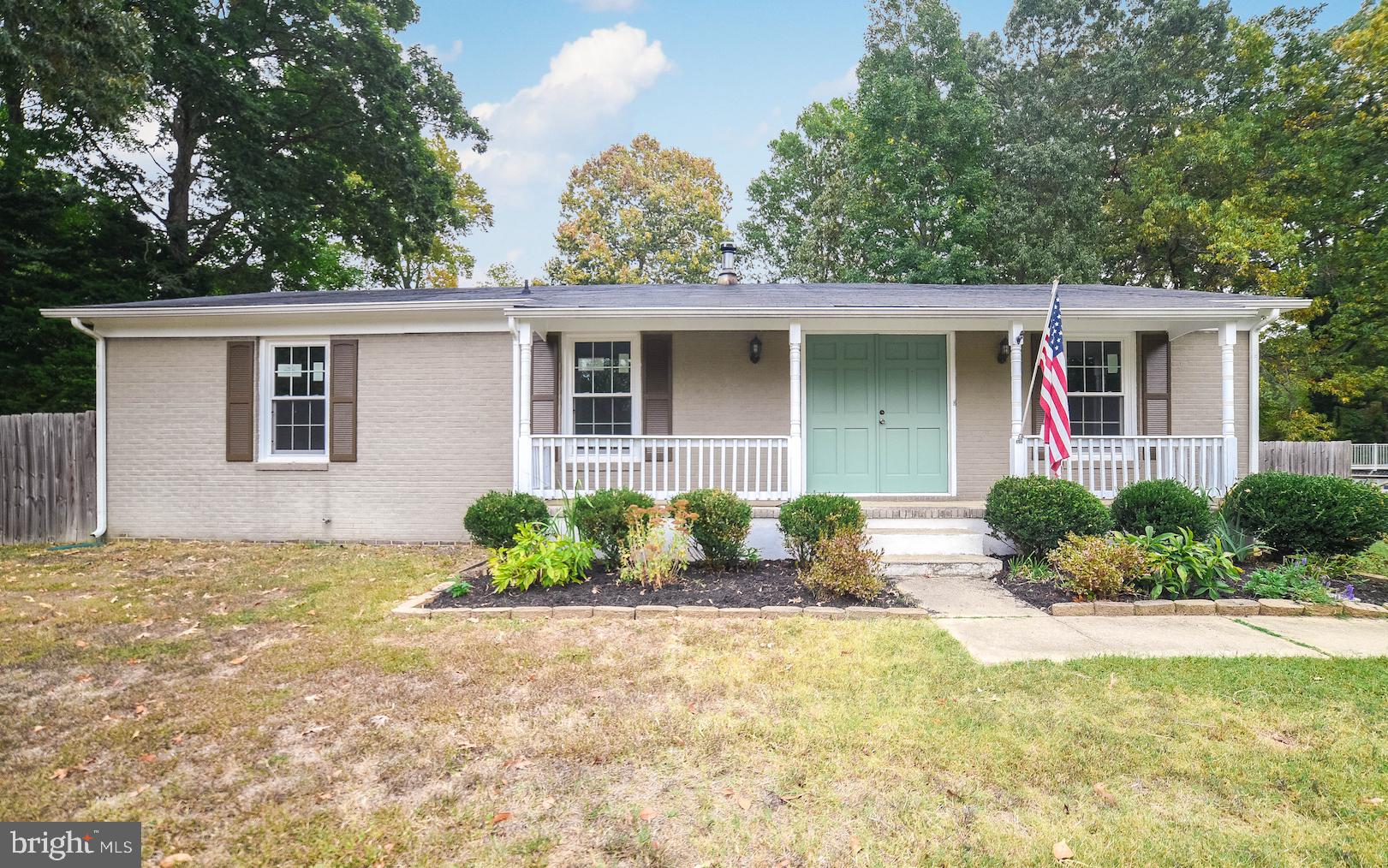 What an adorable rambler! This one leaves nothing to do but unpack. New windows, new siding, new cabinets, new counter, new tile back-splash, new bathrooms to name a bit of the work that has gone into making this one shine. Hardwood throughout with carpet in the bedrooms and new tile in baths. Backyard is fenced in and level and is home to a new deck. Additionally, sellers are providing a home warranty. Come take a look-you won't be disappointed! Pictures will follow