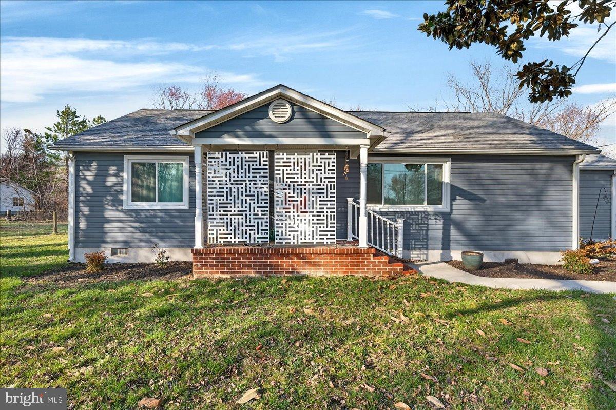Nestled on a sprawling 2.83-acre lot in a serene rural setting, this exquisite 3 bedroom, 2 bath ranch-style residence, originally built in 1959 and masterfully renovated in 2022 down to the encapsulated crawl space, offers a harmonious blend of luxury and comfort. The exterior, adorned with elegant vinyl siding, features a private gravel driveway leading to a charming porch, perfect for enjoying rural views of the surrounding outdoor spaces and trees. Step inside to discover a meticulously designed interior boasting 1,200+ sq. ft. of refined living space. The traditional floor plan is enhanced by luxury vinyl plank flooring and recessed lighting, creating an inviting ambiance. The gourmet kitchen, complete with upgraded countertops and an island, seamlessly flows into the dining area, ideal for entertaining. Three spacious bedrooms, including an entry-level option, provide ample space for relaxation, while two beautifully appointed bathrooms feature both stall and tub showers. For horse enthusiasts, this property is a dream come true, featuring a two stall horse barn with a run-in, The barn has water and electric allowing for a truly enjoyable equestrian lifestyle. The in-ground pool invites leisurely afternoons, while the partly wooded lot ensures privacy and tranquility. With energy-efficient windows and a smoke detector for added safety, this home combines modern conveniences with rustic charm. Experience the ultimate in country living, where every detail has been thoughtfully curated to enhance your lifestyle while being close to town and all you need.