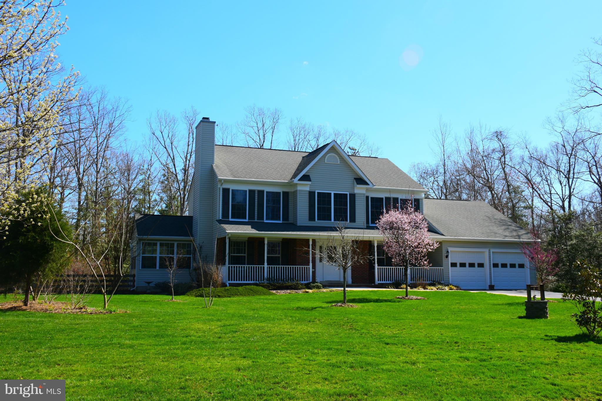 Nice Brick Front Colonial on manicured private 2 acre lot! Hardwood floors in dining room, living room and foyer. Ceramic floors in the kitchen with corian countertops. Large sunroom. Rec room, office, full bath, wet bar and large workshop/ storage area in the basement. This home has new flooring and paint thru out. Whole house humidifier, alarm, water softner system and many more upgrades.