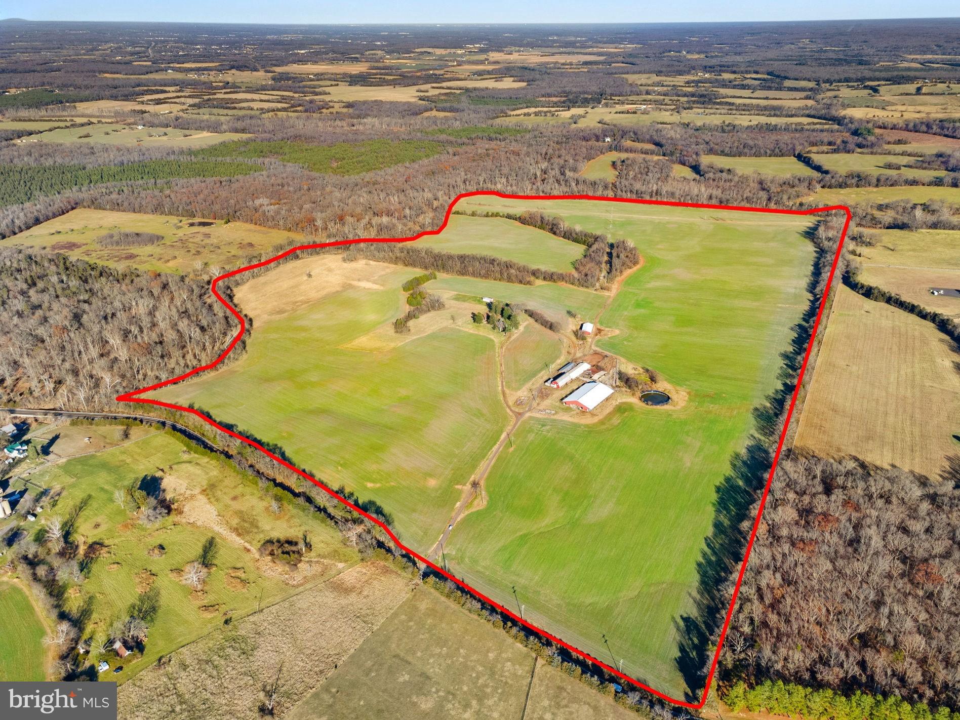 Mountain Valley Farm is a beautiful 242-acre farm with softly rolling fields located around 8 miles east of the Town of Culpeper off Carrico Mill Rd.  The property is bounded by trees on every side, with 1.3 miles of stream frontage on Mountain Run for your recreational enjoyment. An existing farmhouse is perfectly situated on top of a knoll overlooking the farm, offering a panoramic view that encompasses five counties!  The surrounding area was the scene of a notable Civil War battle and will appeal to history buffs and nature lovers alike.  Hunters will appreciate the natural populations of white-tailed deer, turkey, dove, and coyotes.  The property was recently in use as a dairy farm, and has been used for farming and dairying since the area was settled in the late 18th century.  Some farm buildings still exist from when Mountain Valley Farm was more fully utilized, but which are no longer being used or maintained.  These include a dairy barn (which had a herringbone milking parlor with ten units and a 2,000 gal Mueller tank) with holding pen and a 110’ x 170’ stall-free barn that was built in 2007.  Additional structures include a 40’ x 90’ machinery shed and 101’ x 10’ Slurrystore manure structure.  

A conservation easement is in place through the Department of Historic Resources intended to preserve the rural beauty and historical significance of the farm while still allowing improvement and modernization.  Owners may reconstruct one single-family home (up to 4,500 SF above ground) at the site of the current farmhouse, plus one tenant home (up to 3,500 SF above ground) and associated smaller buildings (like detached garages, sheds, gazebos, or a pool house).  A swimming pool or tennis/sport court, and a parking pad are allowed, along with a wide variety of agricultural and farm-related buildings and structures.  Commercial uses are also allowed as long as they are performed inside/within the structures.  The property may not be subdivided; it is being sold as, and must remain, one parcel.  Please refer to the full terms of the conservation easement in the offering memorandum to determine what can or cannot be built on the property.  Mountain Valley Farm occupies a convenient location near Route 15 and Route 3 with easy access to Culpeper, Bealeton, Warrenton, and Fredericksburg.