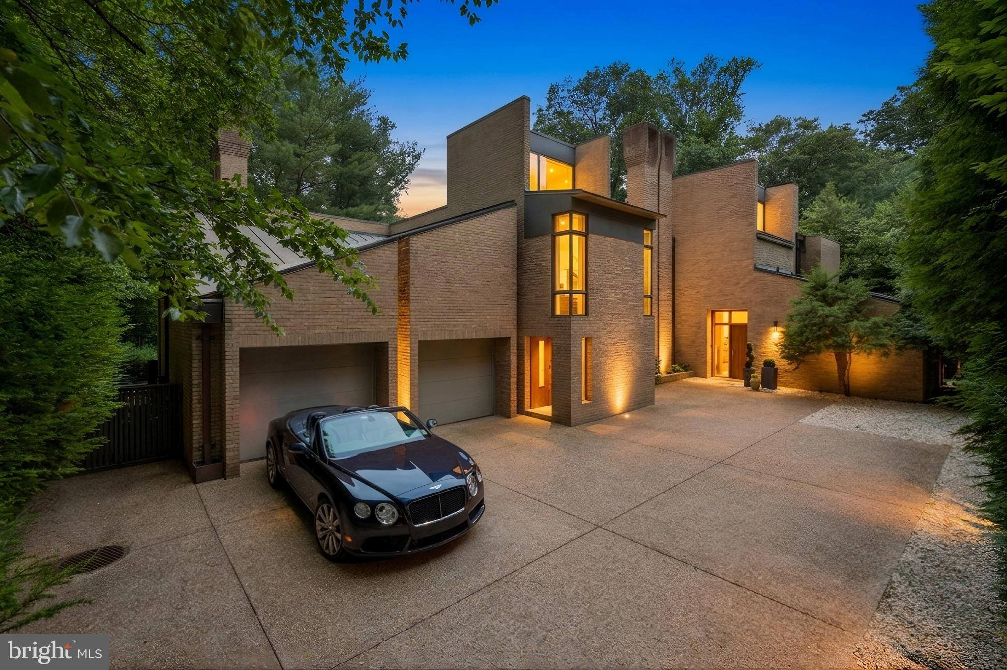 This significant Mid-Century home, designed by Charles Goodman, is a rare McLean treasure. Its exceptional Gold Coast location is further elevated by a private, parklike setting. A major 2012 renovation by Added Dimensions seamlessly integrated modern conveniences while preserving the home’s original contemporary character and timeless finishes. Spanning 5,461 square feet, the residence offers 5 bedrooms and 4.5 bathrooms. The gorgeous grounds border a national park, providing ultimate privacy and serene garden views. An open-concept layout features polished concrete and hardwood floors, creating a smooth flow throughout. An attached garage offers convenient parking, complemented by an expansive motor court for additional vehicles. This prime location delivers both tranquility and accessibility, with easy access to DC, Tysons, and the airports. Experience the ideal blend of style, space, and natural beauty in this one-of-a-kind property.