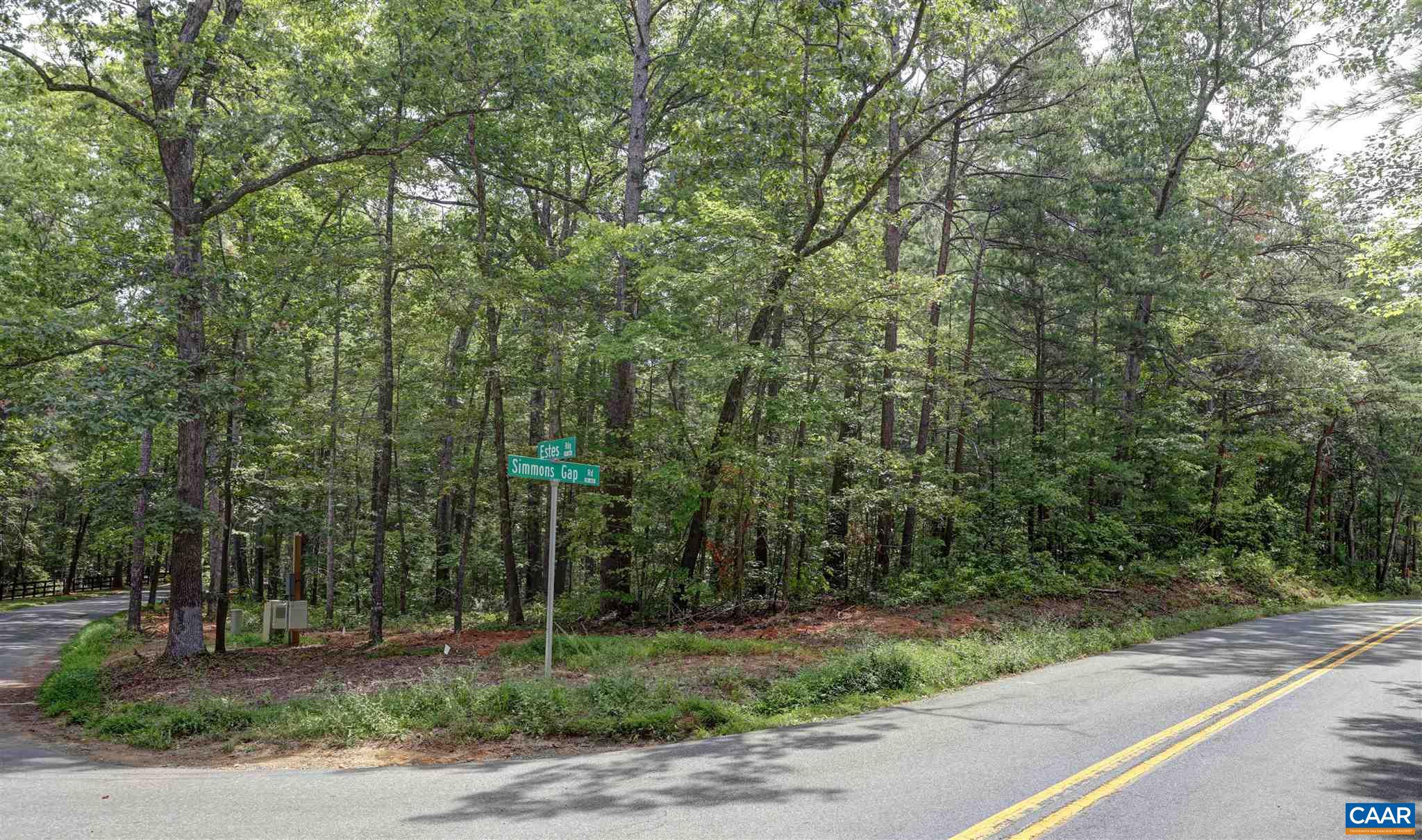 CORNER OF SIMMONS GAP ROAD AND ESTES RIDGE ROAD -  Ten acres of mature woods stategically located on the corner of Simmons Gap and the country lane of Estes Ridge. Property which has long road frontage consists of two parcels being combined and sold as one. No Home Owners Association! Design and build  your dream residence on this very well priced parcel. Located between Free Union and Earlysville, but so convenient to Charlottesville, University of Virginia. Airport, UVA's North Fork Research Park and National Ground Intelligence Center.