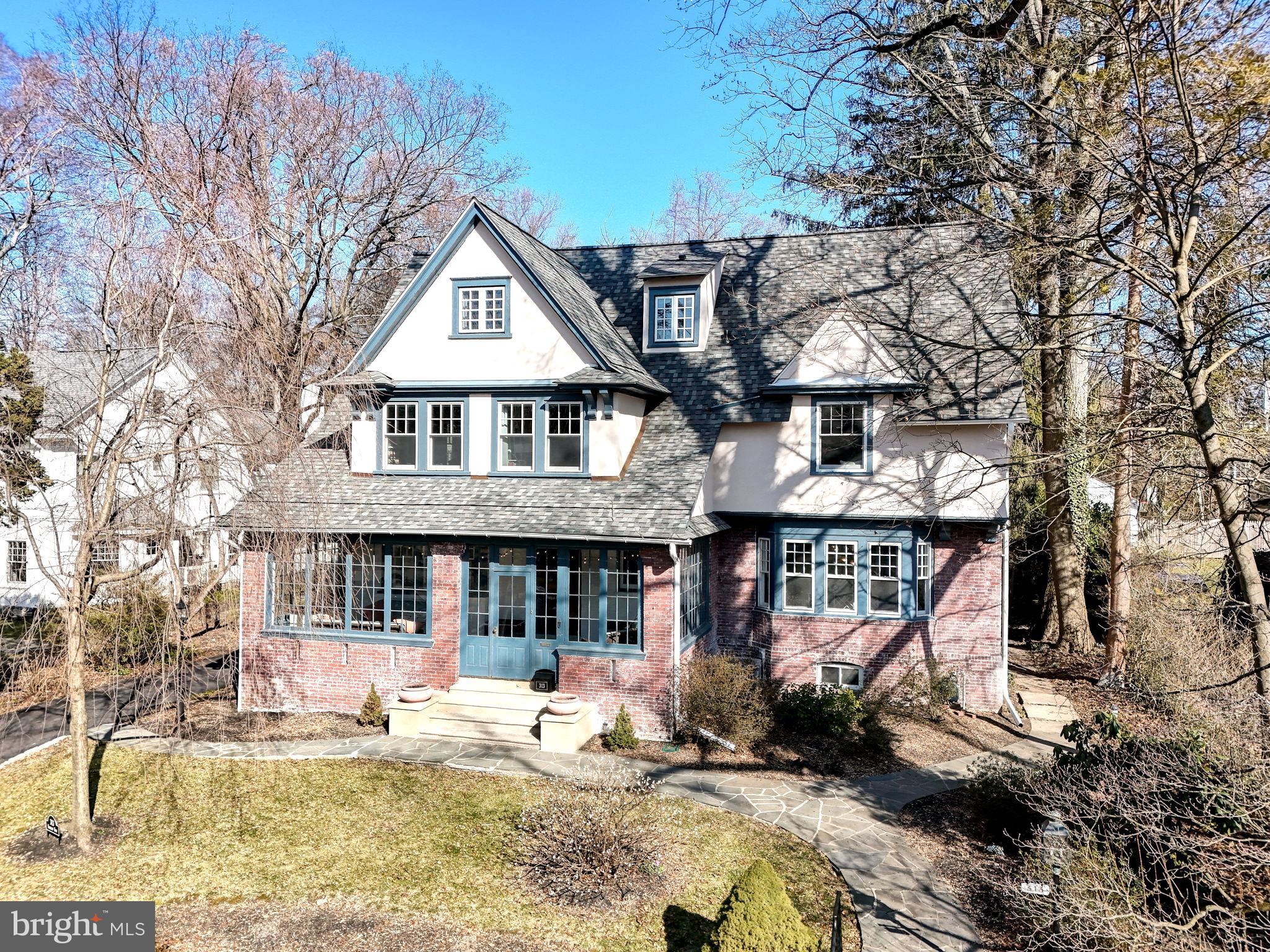 Discover the perfect synergy of professionalism and romance at 313 Berkeley Road, an impeccably maintained colonial residence nestled on one of Merion Station's most sought-after streets. This distinguished property effortlessly marries classic charm with contemporary refinement, boasting timeless features such as hardwood floors and abundant updated windows that bathe each room in natural light. From the inviting foyer to the formal living room with a gas fireplace and a spacious dining area complete with an adjoining butler's pantry, every detail is designed for seamless entertaining. The kitchen, with its granite countertops, large center island, and stainless steel appliances, offers a perfect balance of classic aesthetics and modern functionality. Step outside to the back patio and take in the view of a private backyard adorned with meticulously maintained gardens that evolve with the seasons. The second and third floors house versatile living spaces, including a primary suite with an updated ensuite bathroom, an amazing new additional bathroom in the hallway, and another renovated bathroom on the third floor. The finished basement provides additional living functional areas. This residence is an invitation to a lifestyle where every element exudes sophistication, making 313 Berkeley Road an emblem of refined living in the heart of Merion Station.