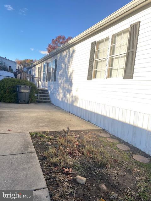 Welcome home!!!!! Three bedroom two full baths ,new carpet, updated c/a ,heat. Newer roof, two decks two parking space driveway. Master bedroom with private shower and tub. Open floor plan ,wood burning Fireplace wood cabinets in kitchen, island in kitchen, separate laundry room. Buyer must be park approved Park rent is $782.00 includes water, trash, snow removal. New carpet, some fresh paint .Ready to move in .Come see now!!!!!!!