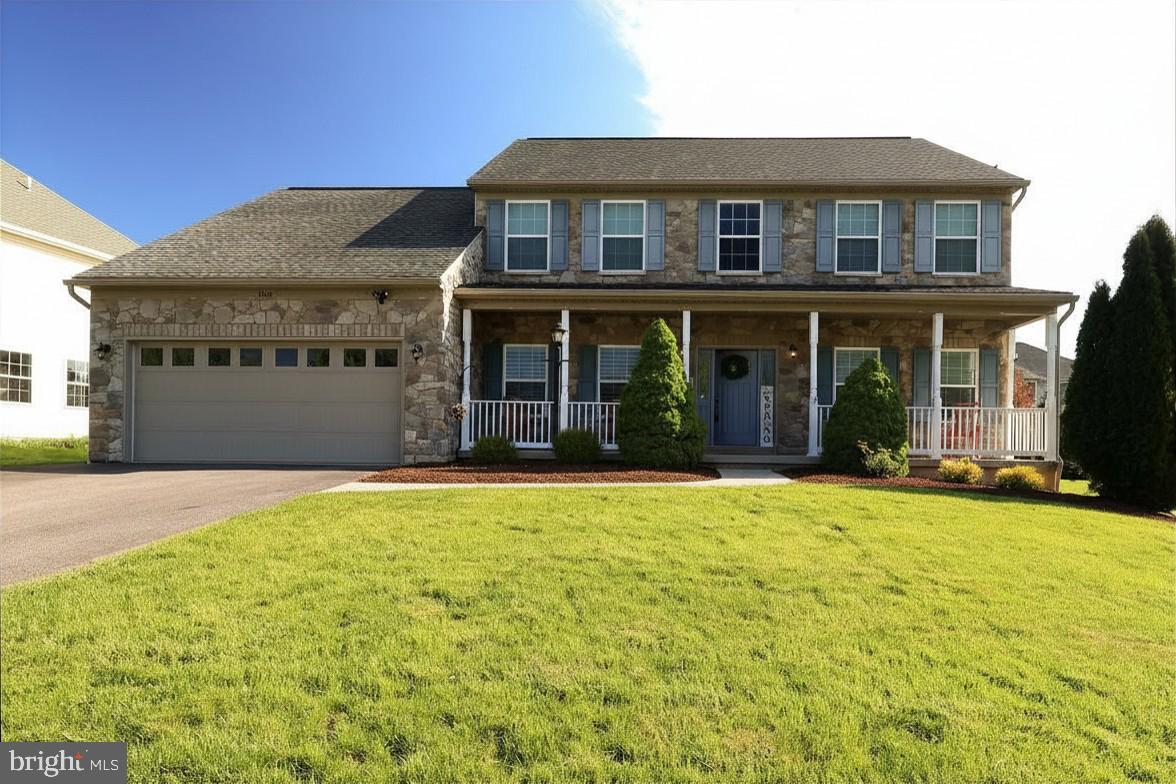 Seller is offering a $5,000 flooring credit to buyers with acceptable contract terms to the seller.  Set in the coveted Fieldstone subdivision where mountain views, paved paths & effortless access to 322 create an unmatched lifestyle this refined two story residence blends timeless craftsmanship with thoughtful upgrades throughout. A welcoming covered front porch opens to gleaming hardwood floors, a grand two story foyer & a floor plan designed for both everyday comfort & elevated entertaining.  Glass French doors lead to a private home office, while the heart of the home unfolds into a beautifully appointed kitchen featuring rich solid wood cabinetry, granite countertops, complementary tile backsplash, stainless appliances & a work island with pendant lighting. The adjoining dining area offers seamless indoor outdoor living with sliding doors to the rear deck overlooking the flat, tree lined backyard.  The kitchen flows effortlessly into the spacious family room, anchored by a striking floor to ceiling stone fireplace. A formal dining room & separate living room provide additional gathering spaces, while a powder room & main level laundry add convenience.  The stunning hardwood staircase leads upstairs to a serene primary suite complete with a generous walk in closet with custom built ins & a spa inspired full bath featuring ceramic tile flooring, a soaking tub, walk in shower & an oversized double vanity offering plenty of storage. Three additional well appointed bedrooms & another full bath complete the second floor.  The finished lower level is an entertainer’s dream a 28x23 rec room with built ins & a wet bar perfect for Penn State game days, plus a full bath with walk in shower, office & exercise room ideal for guests or flexible living. Ample unfinished storage space with built in shelving ensures everything has its place.  Additional highlights include radon mitigation, natural gas forced air heat, central air conditioning & an attached 2 car garage. All just minutes from the Mt. Nittany Expressway, historic Boalsburg, parks, schools, shopping & some of the area’s most beloved local eateries & breweries.  A rare combination of location, craftsmanship & lifestyle this Fieldstone beauty delivers the space, setting & sophistication today’s buyers are seeking.