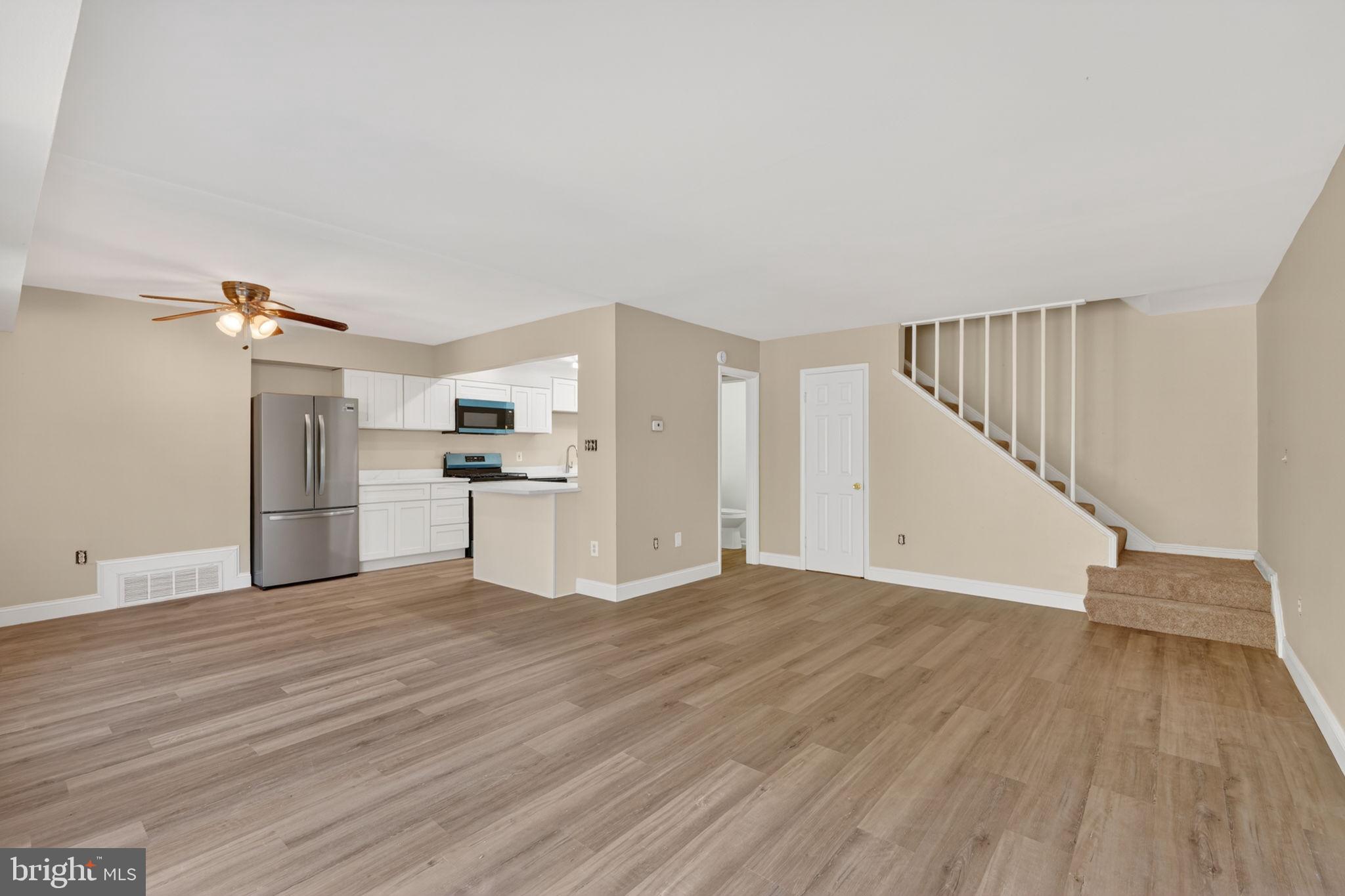 Welcome home to this beautifully renovated two-level townhouse offering modern finishes and move-in-ready appeal! Freshly painted throughout, the main level features an open-concept living and dining area that flows seamlessly into the updated kitchen, complete with brand-new stainless steel appliances, quartz countertops, shaker-style cabinetry, and a center island perfect for meal prep, entertaining, or casual dining.

Conveniently located on the main level are a half bath and in-unit washer and dryer. Upstairs, you’ll find two spacious bedrooms and a fully renovated bathroom featuring a luxurious soaking tub—perfect for unwinding after a long day.

Enjoy outdoor living on the private front patio and the convenience of your own reserved parking space. The condo fee includes gas and water, adding exceptional value and affordability. Whether you’re a first-time homebuyer or an investor seeking a turnkey opportunity, this stylish and low-maintenance home is one you won’t want to miss!