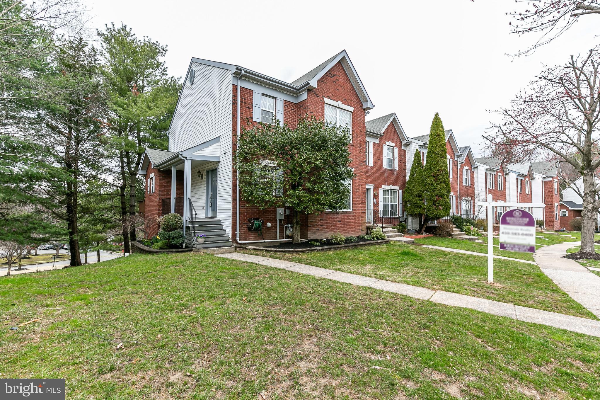 Located in desirable New Town Community, this large end of group townhome has over 2100 sf of living space.  Newly painted and elegant crown moulding throughout, this home has it all.  Large entry from private side front porch to hardwood foyer.  The large living room flows easily to the dining room and eat-in kitchen with stainless appliances.   Slider door to deck.   Large master bedroom with his/hers closets, crown moulding with lighting.  The master bedroom also has a recently renovated en suite bath including granite counters, spa tub and separate shower with heavy glass doors.    Two more large bedrooms and an updated bath complete the second level.  The lower level is fully finished including a large separate laundry room, work room, half bath and large family room with slider to back patio.  Come see this lovely home!