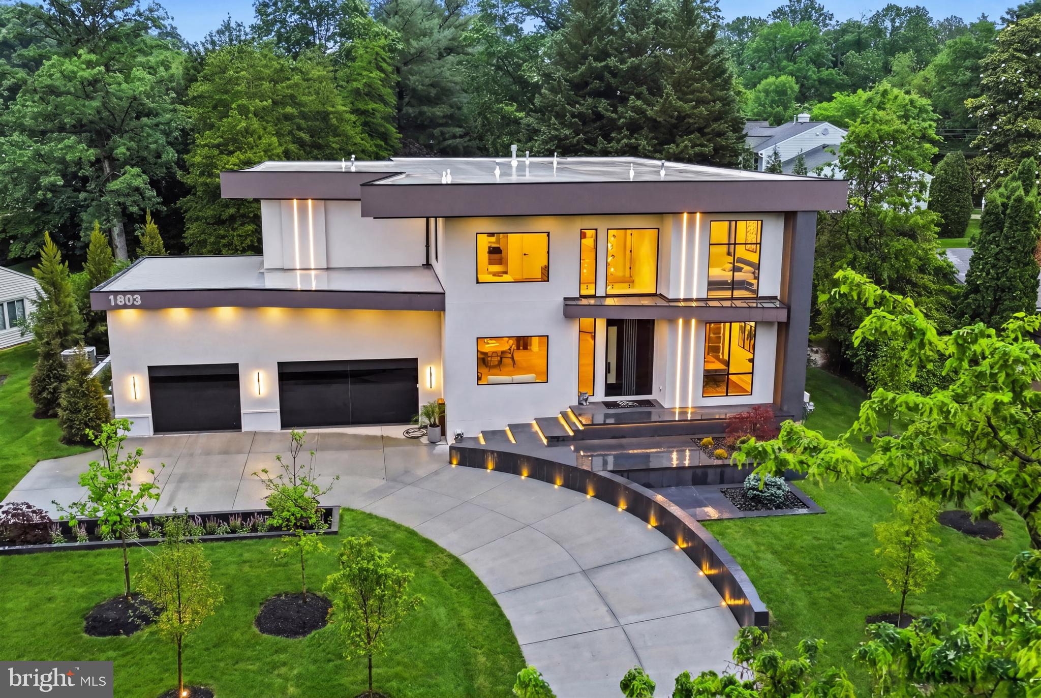 Grand Unveiling:  6.11.26 from 12pm - 6pm

Welcome to Aurora House — Miami in Mclean-a contemporary architectural masterpiece in the heart of McLean, VA, where modern luxury, cutting-edge technology, and resort-inspired living converge to create one of Northern Virginia’s most exceptional residences.

Perfectly positioned in the prestigious Chesterbrook area of McLean, this newly constructed estate offers over 8,000± square feet of thoughtfully curated living space on a lush 15,564 SF lot. Designed for elevated everyday living and grand-scale entertaining alike, Aurora House seamlessly blends sophisticated architecture with functional luxury.

From the moment you arrive, the residence makes a striking impression with its dramatic modern exterior, expansive walls of glass, floating architectural staircase, and seamless indoor-outdoor flow. Inside, the home features 5 spacious bedrooms, 8 luxurious bathrooms, soaring ceilings, designer finishes, and an open-concept layout curated for today’s modern lifestyle.
At the center of the home is a world-class gourmet chef’s kitchen featuring premium Dekton countertops, top-of-the-line Wolf and Sub-Zero appliances, integrated coffee maker, and custom-designed cabinetry by CASAMODERNA finished in an ultra-luxury White Oak veneer. Frameless outlets have been thoughtfully integrated throughout the kitchen for a sleek, nearly invisible appearance that enhances the home’s clean contemporary aesthetic. Complementing the main kitchen is a fully equipped secondary kitchen, ideal for entertaining, catering, and multi-generational living.

Aurora House was designed to deliver an elevated lifestyle experience with amenities rarely found in the Northern Virginia market. The home includes a bar, sauna, steam shower, heated floors (Primary bathroom), gym, wine display, custom closets systems, second kitchen, outdoor kitchen, swimming pool, covered patio, covered balcony, integrated speakers, elevator shaft, smart home features and privacy with mature trees.

The lighting system at Aurora House was designed and implemented at a custom, state-of-the-art level, elevating the home’s architecture, ambiance, and functionality. Features include smart switches, low-voltage LED lighting, custom-built exterior lighting, custom-built interior lighting, and designer-style modern light fixtures throughout the residence. The sophisticated lighting design enhances every architectural detail and transforms the home into a true modern showcase.

Designed with both comfort and performance in mind, the oversized 3-car garage features custom-built garage doors, ultra-quiet garage motors, EV charging capability, epoxy flooring, and custom tile baseboards — creating a true showroom-quality automotive experience.

The resort-style outdoor living experience rivals luxury destinations around the world. The heated saltwater swimming pool features an automatic cover, integrated lighting, endless swim jets, spa/hot tub features, and a premium quartz plaster finish — a highly durable and stain-resistant surface that blends traditional plaster with crushed quartz aggregate for enhanced beauty and longevity. The outdoor entertaining area is completed by a fully equipped outdoor kitchen featuring a built-in grill, sink, and beverage center, creating the ideal setting for year-round entertaining.

Aurora House is fully integrated with a comprehensive smart home ecosystem controlling lighting, cameras, music, pool systems. The property is already equipped with established high-speed internet infrastructure and a UniFi mesh network system throughout the residence. An iPad dedicated to the home automation system will convey to the purchaser at settlement, offering seamless control of the property’s technology systems.

Ideally located just minutes from Tysons Corner, Arlington, and Washington, DC, Aurora House offers the perfect balance of privacy, convenience, sophistication, and connectivity.
Owner/Agent