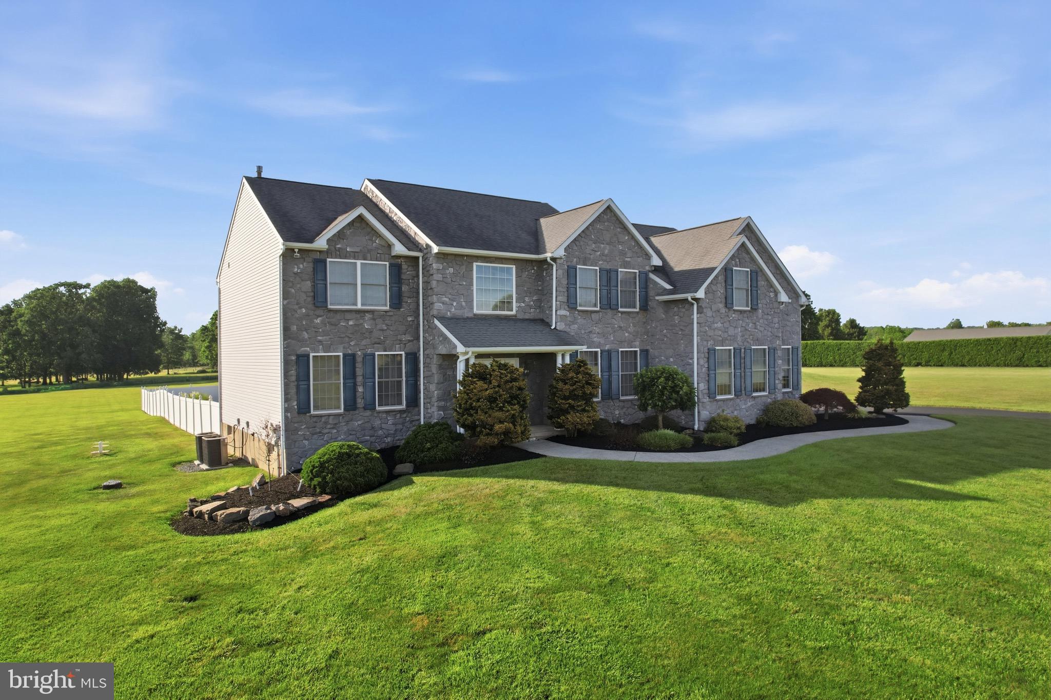 Tucked away on four beautifully manicured acres, this Luxury Estate Home delivers the space, privacy, and amenities most buyers spend years searching for. With a breathtaking country setting, this custom-built stone-front Colonial combines timeless craftsmanship, exceptional outdoor living, and garage space that is nearly impossible to find in today's market.

Step inside to find 9-foot ceilings, front and rear staircases, and a thoughtfully designed floor plan featuring 4 bedrooms and 3.5 baths. The heart of the home is the custom kitchen, complete with a massive granite island, double ovens, 48-inch cabinetry, and abundant workspace for entertaining and everyday living.

Outside, the grounds are simply spectacular. The manicured lawn rivals a private golf course, while the fenced rear yard showcases a massive heated in-ground pool that feels more like a luxury resort than a backyard.  This is more than a home—it’s a place where memories are made. Summer weekends will be spent relaxing by the pool, hosting family gatherings, and enjoying the kind of outdoor space most people only dream about. 

Car enthusiasts, hobbyists, and outdoor adventurers will appreciate the attached 3-car garage plus an incredible 30' x 40' heated detached garage with 12-foot ceilings—ideal for collector cars, a workshop, recreational vehicles, or the ultimate man cave.

A long driveway, impressive curb appeal, and abundant parking provide plenty of room for guests, campers, trailers, and more. There is truly something here for everyone in the family.

Properties offering this combination of acreage, luxury, garages, and resort-style outdoor living are exceptionally difficult to find—and nearly impossible to recreate at today's construction costs.  Don’t hesitate—opportunities like this are rare, and the memories made here could last a lifetime.