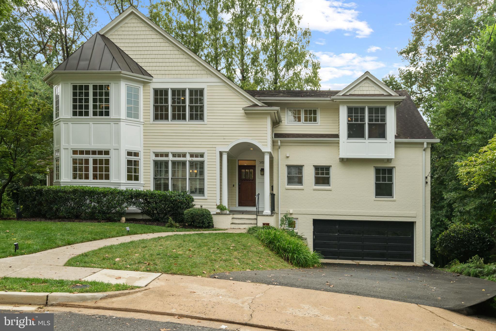 3722 N. Woodrow Street delivers rare scale, privacy, and design in Country Club Hills, one of North Arlington’s most prestigious neighborhoods. Perched on a quiet cul-de-sac this Craftsman-inspired home, completely reimagined in a 2008 renovation, offers almost 5,000 finished square feet of light-filled space on a .41-acre fenced lot, one of the largest lots in the neighborhood, with an in-ground, solar-heated pool and ample yard space. This exceptional residence offers 6 bedroom + office, 5 bathrooms, loft space, and a walk out basement. Main level bedrooms provide flexibility for multi-generational living or work from home space. Open concept living on the rest of the main floor includes a large dining room with plantation shutters, a bright and spacious kitchen with a peninsula bar area and a built-in desk. The great room features hardwood floors, a wood burning fireplace, custom built-ins and an amazing bank of windows overlooking the backyard. A sunroom and deck extend the living area outdoors. Upstairs, you’ll find hardwood floors throughout the upper level. The primary suite is a true retreat complete with box ceiling, a sitting area, a custom walk-in closet and a spa style bath with dual vanities, soaking tub, shower and water closet. 3 additional bedrooms and a renovated hall bath complete this level along with a versatile loft space perfect for a playroom, homework space,reading nook, or a possible 5th bedroom. The current owners have converted one of the bedrooms into a second floor laundry room with two sets of stackable washers and dryers. The walk out basement features another wood burning fireplace, a large rec area, additional laundry room, storage room, access to the 2 car oversized garage and a luxurious new bathroom with a two person dual head shower. You’ll also find a lovely screened in porch that leads to your outdoor oasis and heated pool. The yard is ideal for gardening, games, or entertaining. The residents enjoy neighborhood block parties and an annual 4th of July parade. Highly rated Jamestown, Williamsburg and Yorktown schools. Close to Washington Golf and Country Club, easy access to Clarendon, Tysons or DC. Do not miss your opportunity to live in this rare gem!