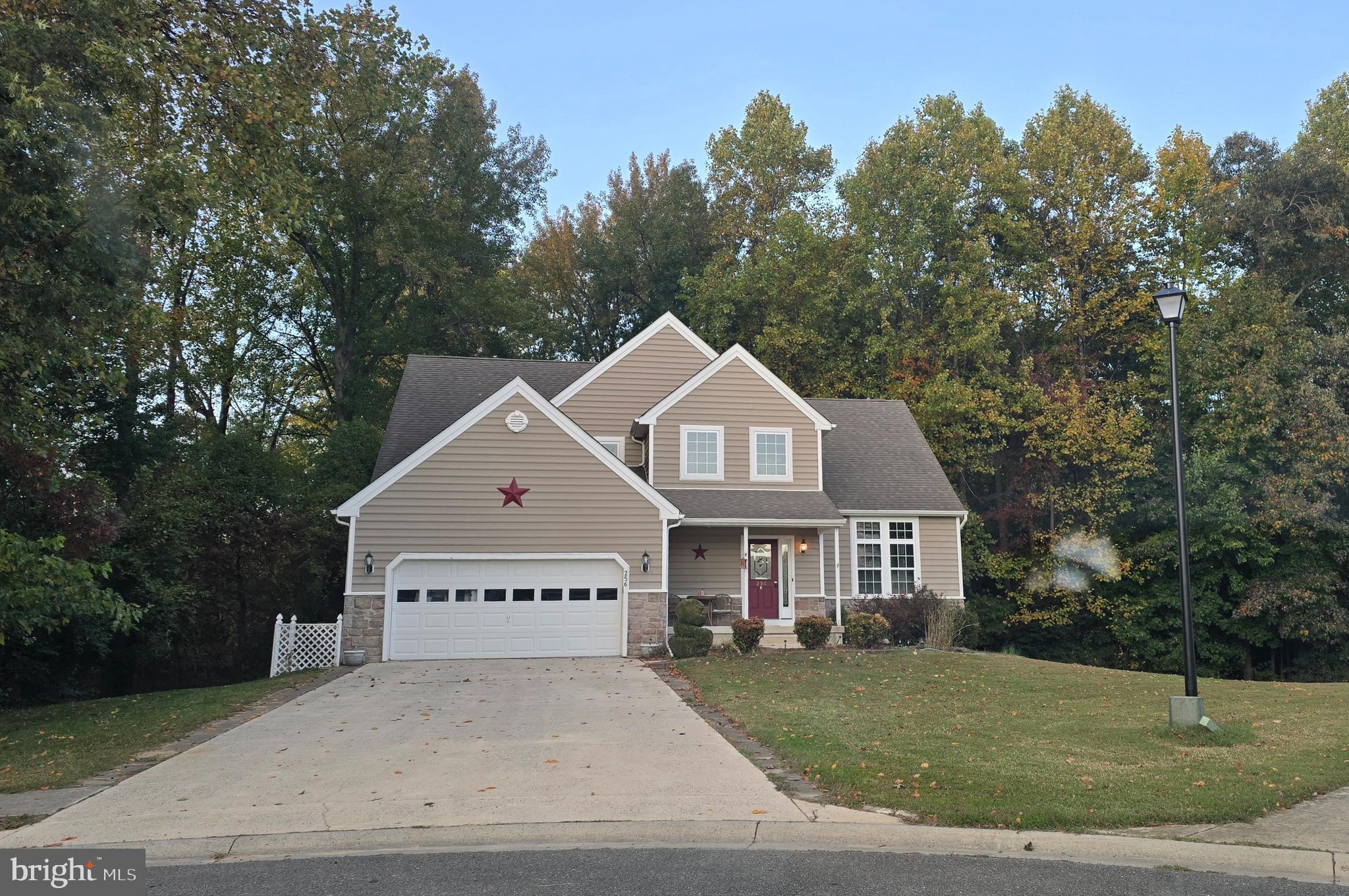 Experience unparalleled privacy at 256 South Landing Drive, featuring a quiet lot in Cul-de-sac, no neighbor to the left or rear, and a private yard , also little fish pond in landscape in front. Step onto the inviting front porch and into the two-story foyer, where gleaming hardwood floors, fresh paint, and brand-new carpet welcome you. The main level features a first-floor master suite with high ceilings and a luxurious bath, including double sinks, a separate shower, and a grand soaking tub.

The oversized living room with a cozy fireplace flows seamlessly into the dining area an updated kitchen with stainless steel appliances, granite countertops with an oversized breakfast/bar counter for additional seating in addition to an eat in kitchen with sliding glass doors to access oversized deck overlooking the private serene backyard and wooded views.

Upstairs, 3 additional bedrooms in addition to a spacious loft, an oversized bathroom with double sinks and a soaking tub, and ample closet space throughout. The full basement spans the entire footprint of the home and includes walk-out access to the back patio, ideal for additional entertaining/living or recreation space.

Additional features include a first-floor laundry area with a washer and dryer, two coat closets, a security system, a two-car garage with a utility sink, and a four-car driveway. With high cathedral ceilings and abundant natural light, this move-in-ready home perfectly combines luxury, functionality, and privacy.

Excellent location Close to beaches yet tucked away. also major roads Rt 113, 13 and 1 which makes for an easy commute.

Don’t miss this rare opportunity, a home in excellent condition, in a fantastic location, and ready for its new owner.

Info HOA https://knottslanding.webnode.page