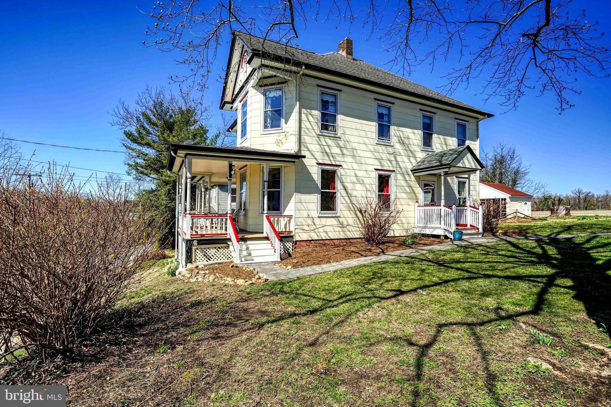 Lovingly restored and maintained Victorian charmer, located in the heart of Historic Hillsboro is now searching for a new owner.  Stepping inside, you'll be transported to yesteryear as you tread on original hardwood floors and enjoy the neutral paint palette of the generously sized rooms.  The living room features a wood burning stove to gather round and enjoy cozy evenings. The dining room and kitchen are also generously sized and offer great storage and counter space to prepare meals together.  The kitchen has an adjoining breakfast room/family room that provides another great community space and is ideal for entertaining guests or intimate family gatherings.  There's a downstairs bath that includes a handy laundry center. Upstairs you'll find three light-filled bedrooms and a full bath. The primary bedroom measures in at 14’ X 21’ which lends space for a reading nook or a sitting/dressing area. The expansive windows create perfect picture frames to take in water views of the Tuckahoe Creek and from the rear you overlook tranquil, pastoral views. Recent updates include blown in attic insulation, newer garage roof and well. This gracious home is sited on a generous .42+/- acre parcel that the owners thoughtfully partnered with Adkins Arboretum to install 8 beds of native landscaping. The property features an outbuilding with a parking space and a workshop with an oversized loft for storage. There's also an additional storage/potting shed. The outbuildings will be useful for outdoor enthusiasts to store kayaks that can be launched just moments away or walking gear that will come in handy at the Tuckahoe State Park (less than a mile away). Conveniently located, the property is bordered by Talbot, Queen Anne’s and Caroline County  -  the Bay Bridge is about a 30 minute drive and the Delaware Beaches are about an hour away!